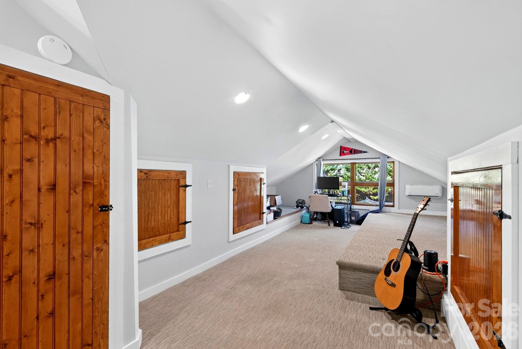 Attic can serve as a play space, bedroom or studio-plenty of storage in side cabinets - 5 Inglewood Road, Asheville