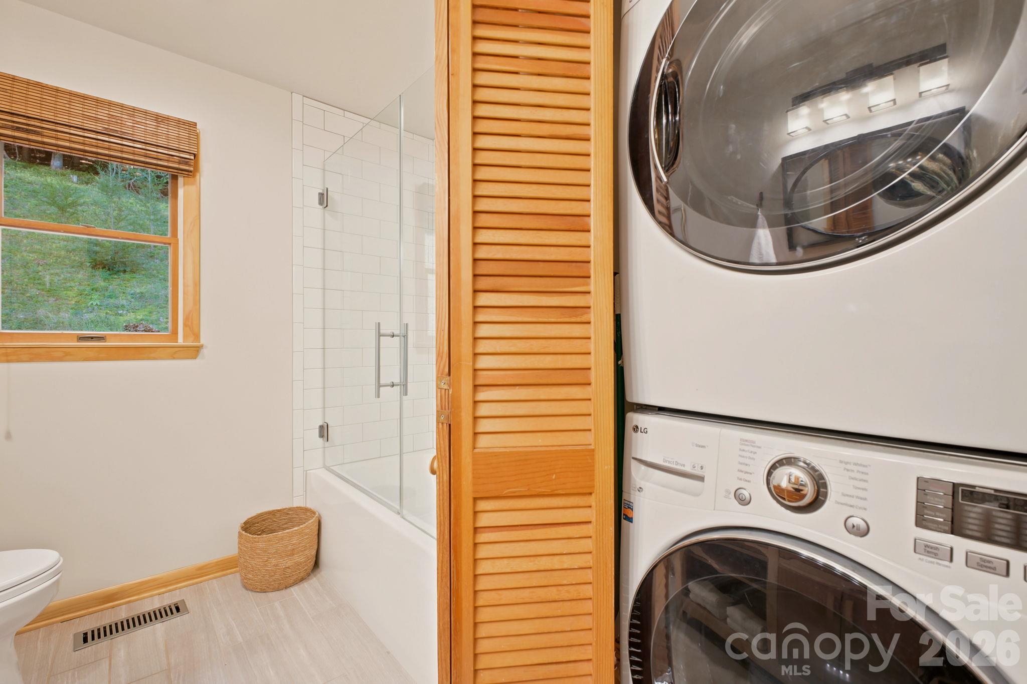 Stack washer/dryer in guest bath on main level - 2711 Rabbit Hop Road, Spruce Pine
