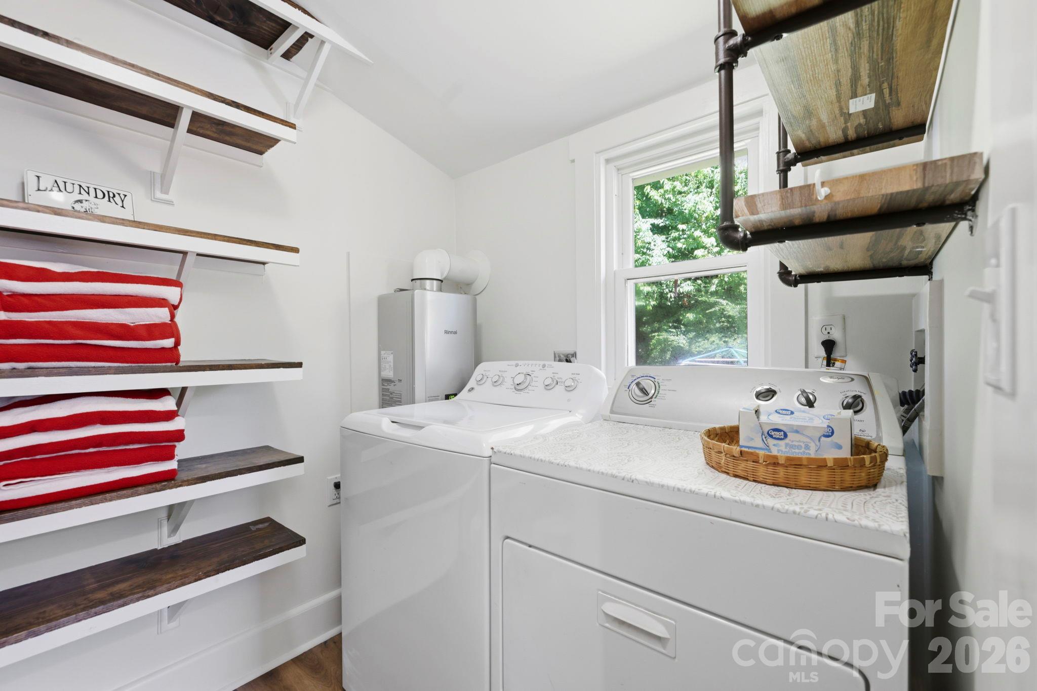 Laundry area and pantry adjacent to kitchen - 2252 Riceville Road, Asheville