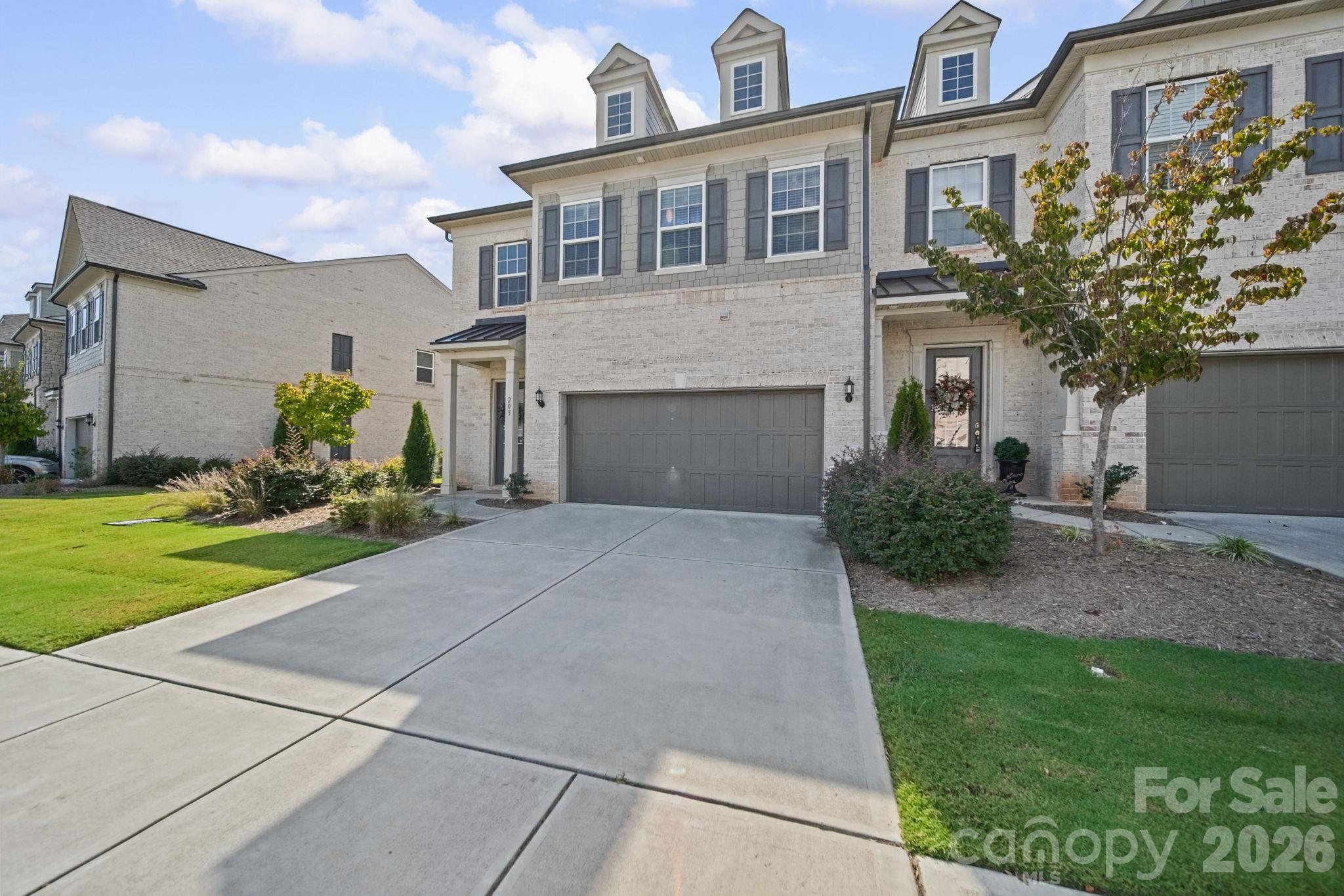 Front, with a double garage - 203 Heathbrook Lane, Waxhaw