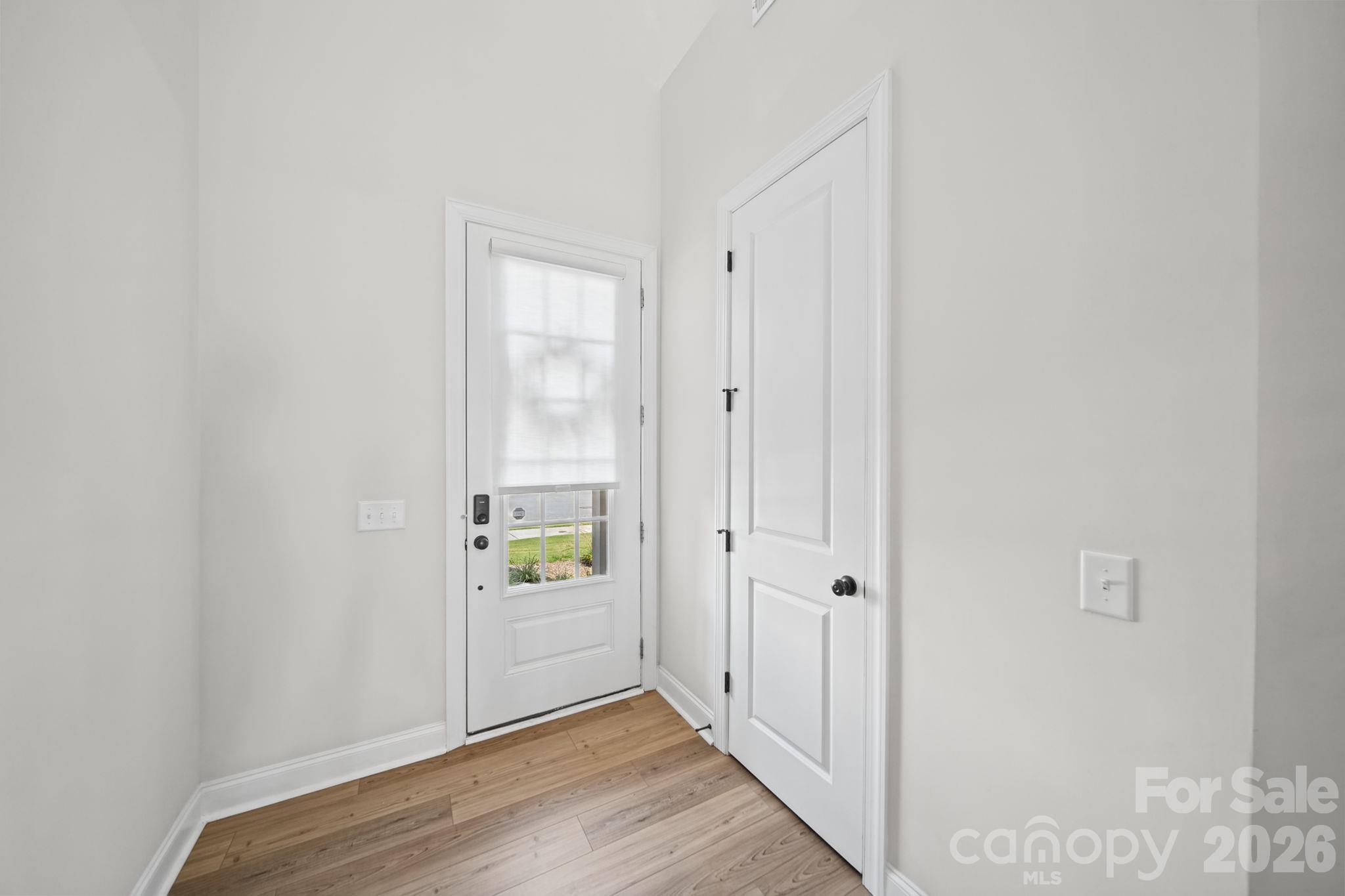 Foyer and door for half bath, main floor - 203 Heathbrook Lane, Waxhaw