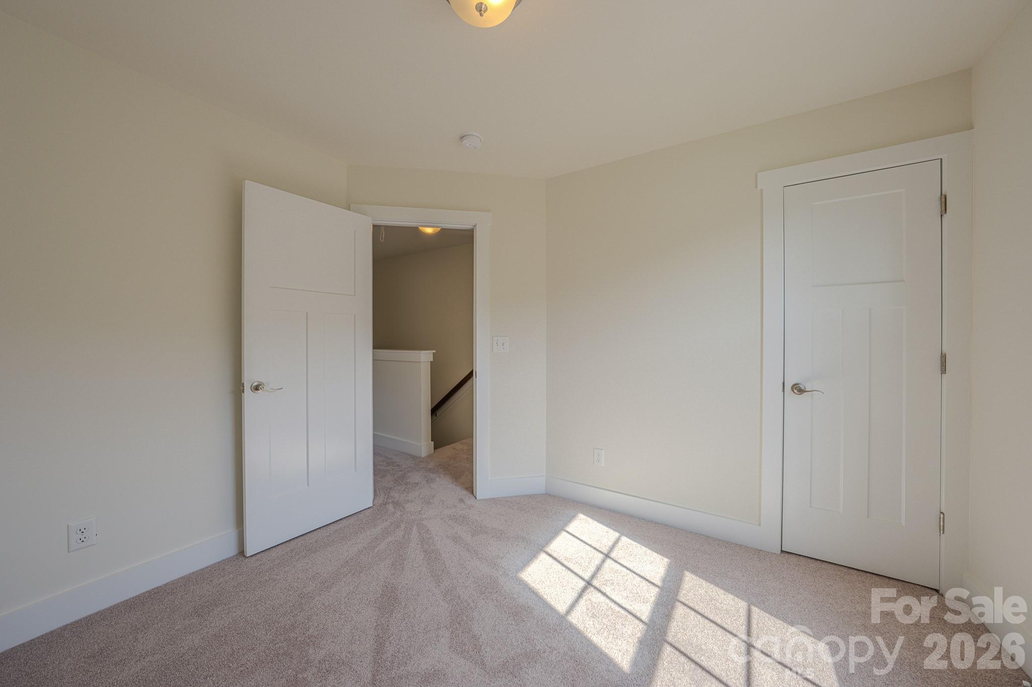 Bedroom 2, door to right with large walk-in closet with window - 623 Cardwell Lane, Fletcher