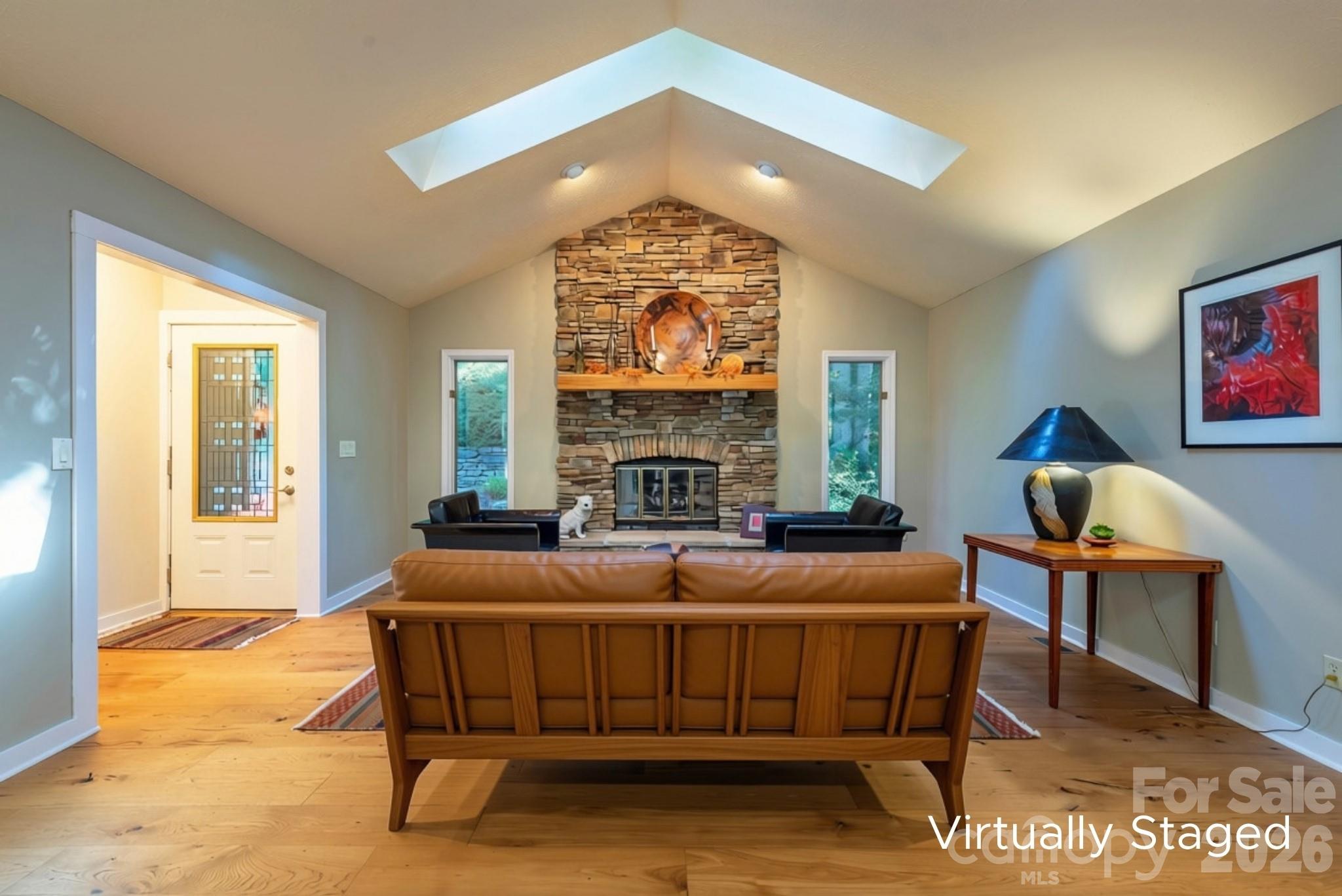 This photo has been enhanced with the addition of a virtually staged couch. - 190 Ridgeview Drive, Hendersonville