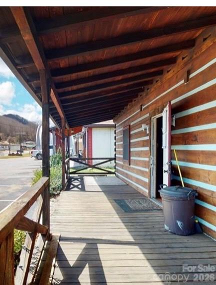 Beautiful front covered porch - being used as workspace now . - 1456 Dellwood Road, Waynesville