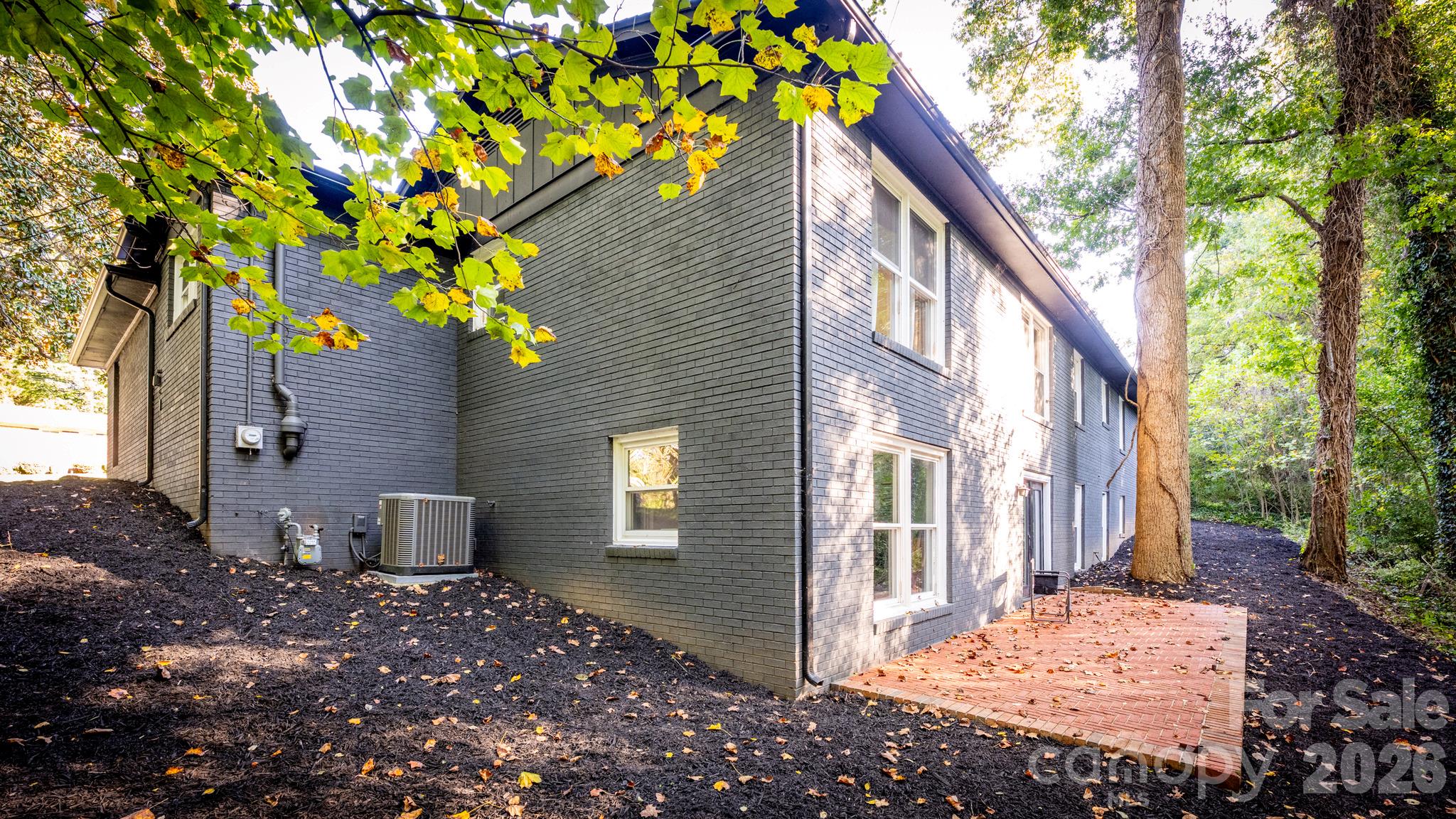 wooded back yard with patio - 508 Berkshire Drive, Statesville