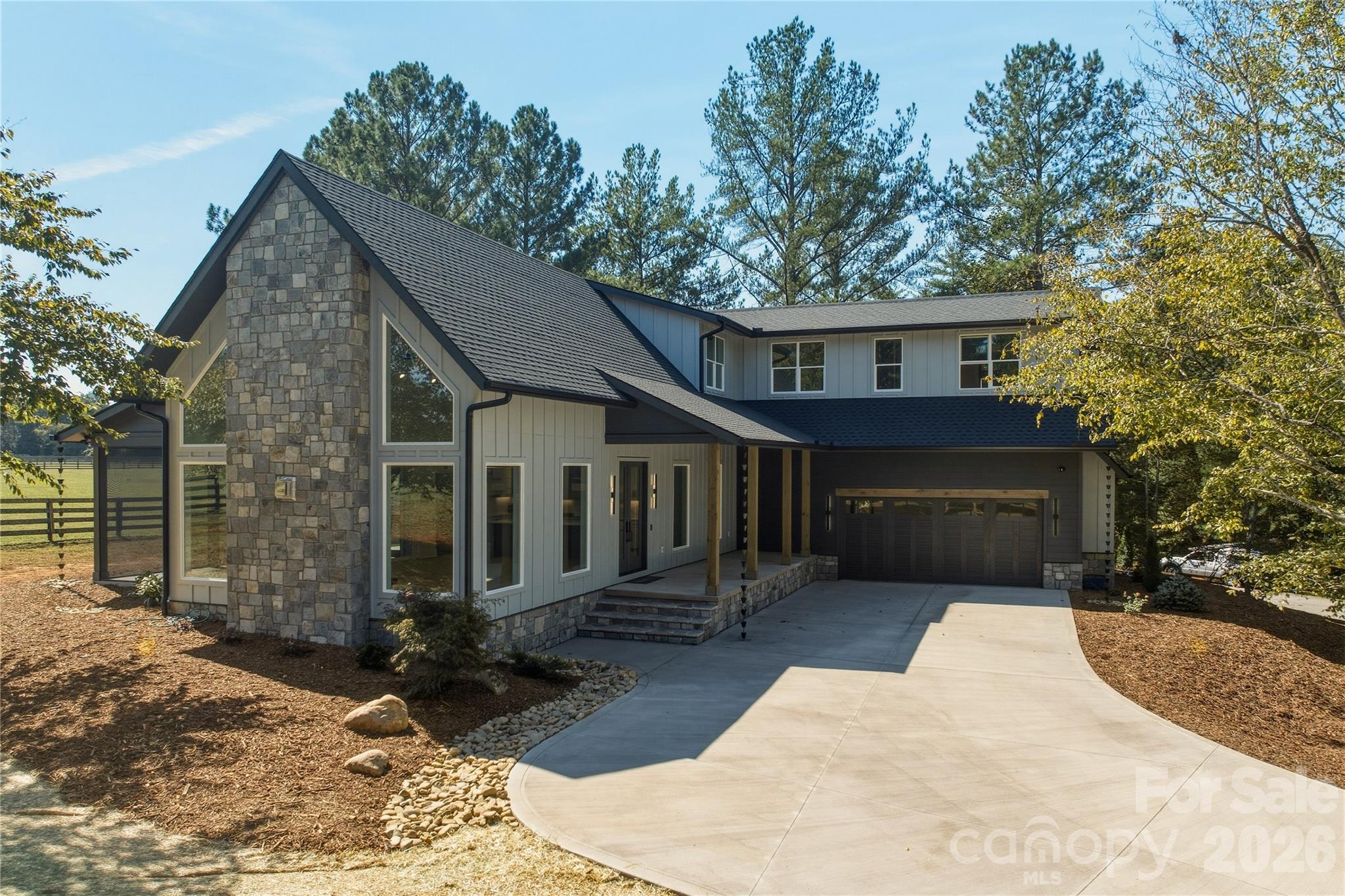 This premium home was built with exceptional quality materials. The exterior of the home is constructed of James Hardie fiber cement siding and stone. The Jeld-Wen windows are oversized and plentiful and there is an architectural shingle roof. - 2303 Paddock Circle, Morganton