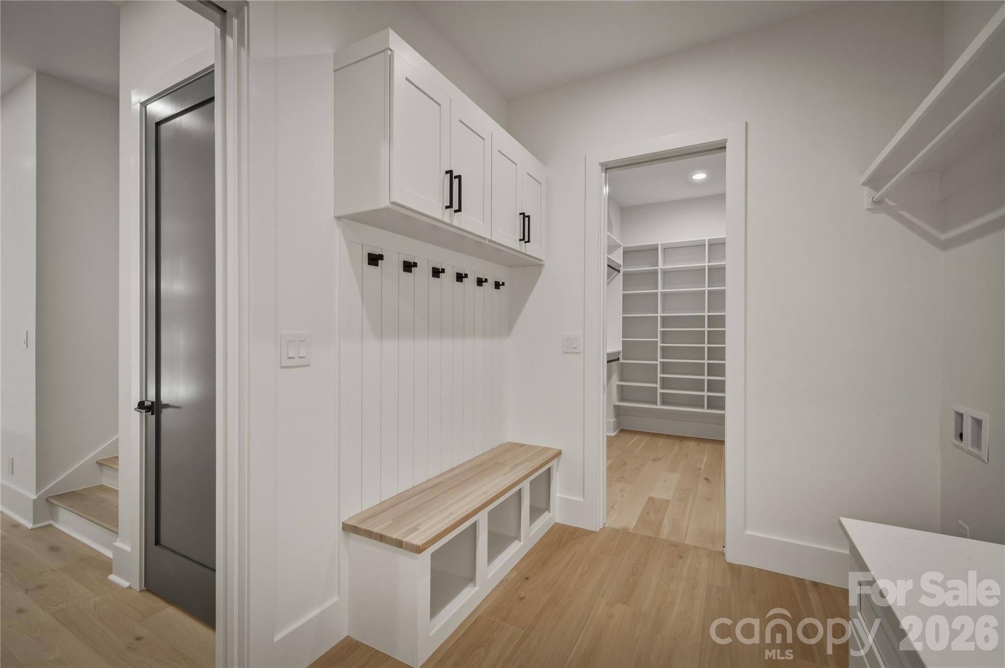 The drop zone area includes a built-in bench, hooks,and cubbies all conveniently located near the door to the garage. - 2303 Paddock Circle, Morganton