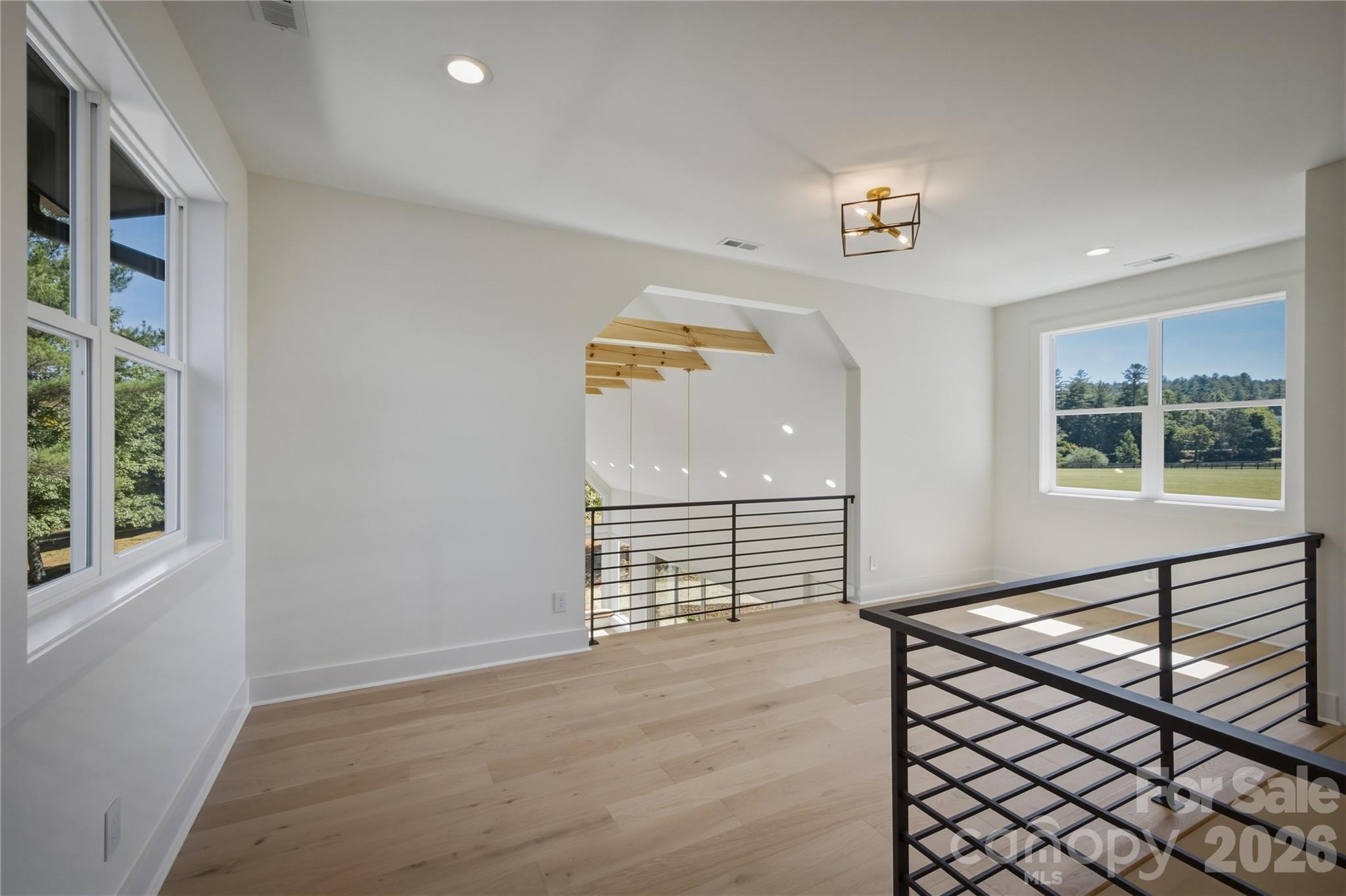 When you walk up the stairs, you will discover this loft area. There is an area suitable for a hangout area or perhaps a pool table. - 2303 Paddock Circle, Morganton