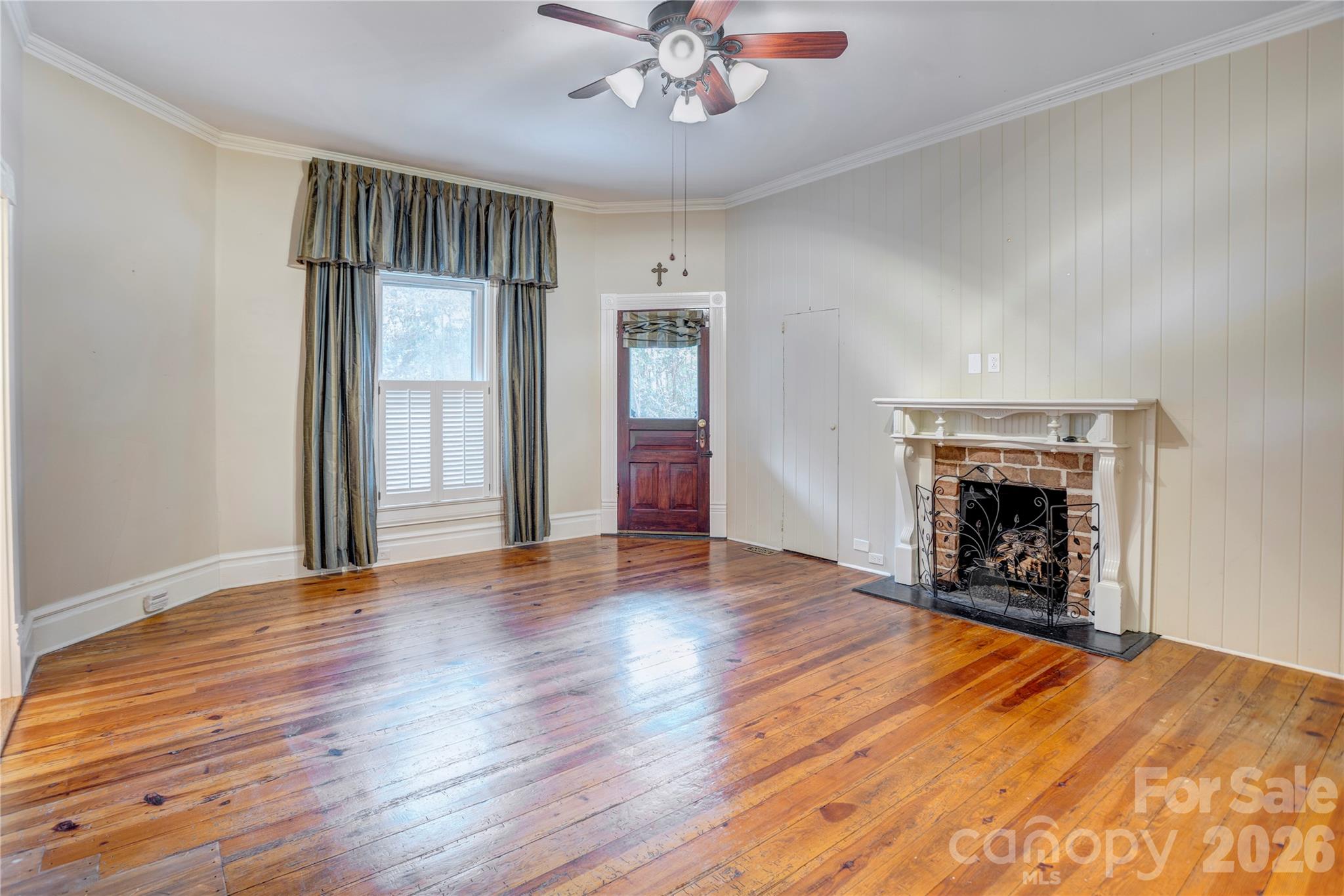 Primary bedroom with access to the wrap around porch. - 30 Georgia Street NW, Concord