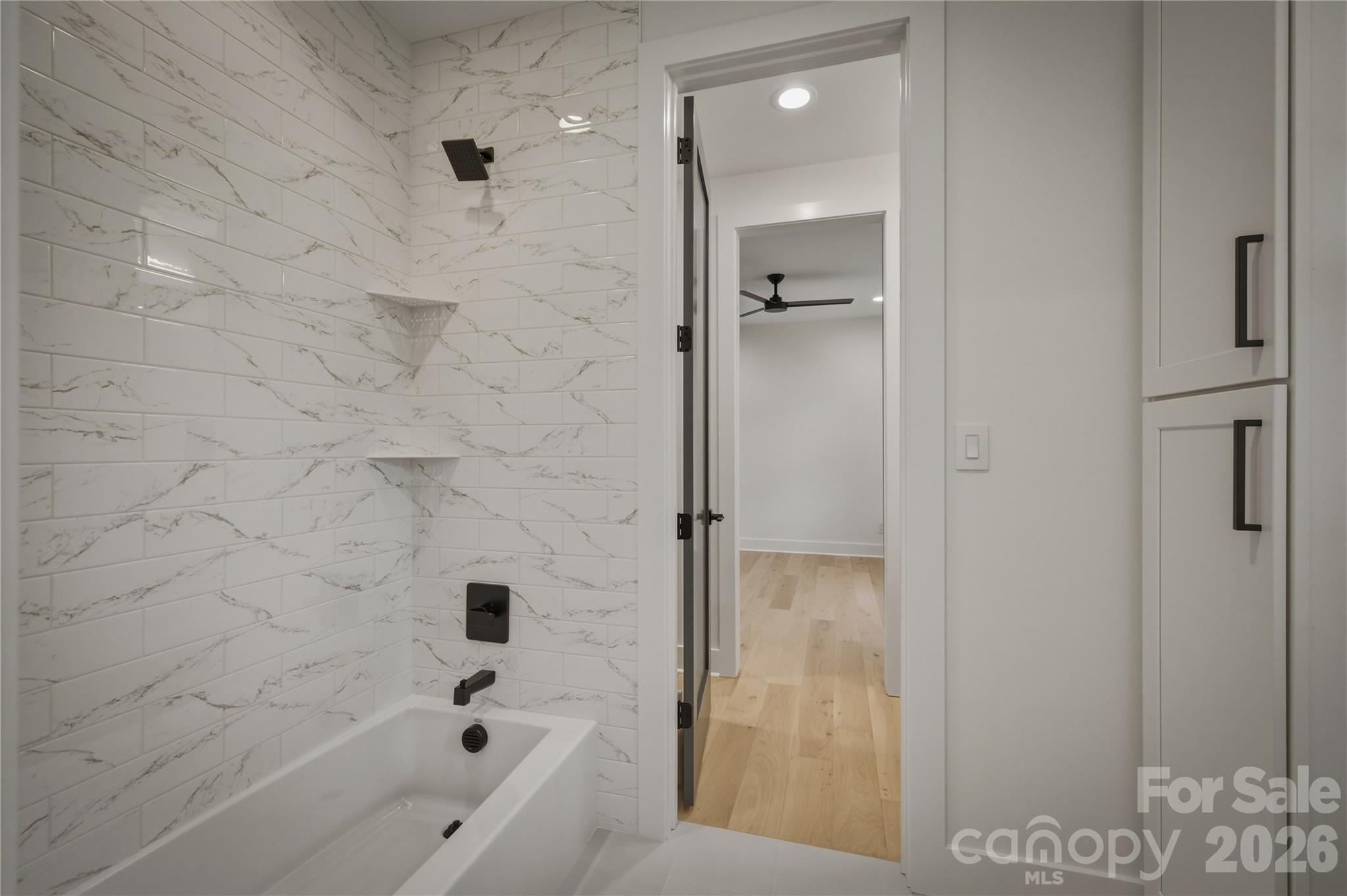 The shared tub/shower and for Suites #2 and #3 and water closet area is next. - 2303 Paddock Circle, Morganton
