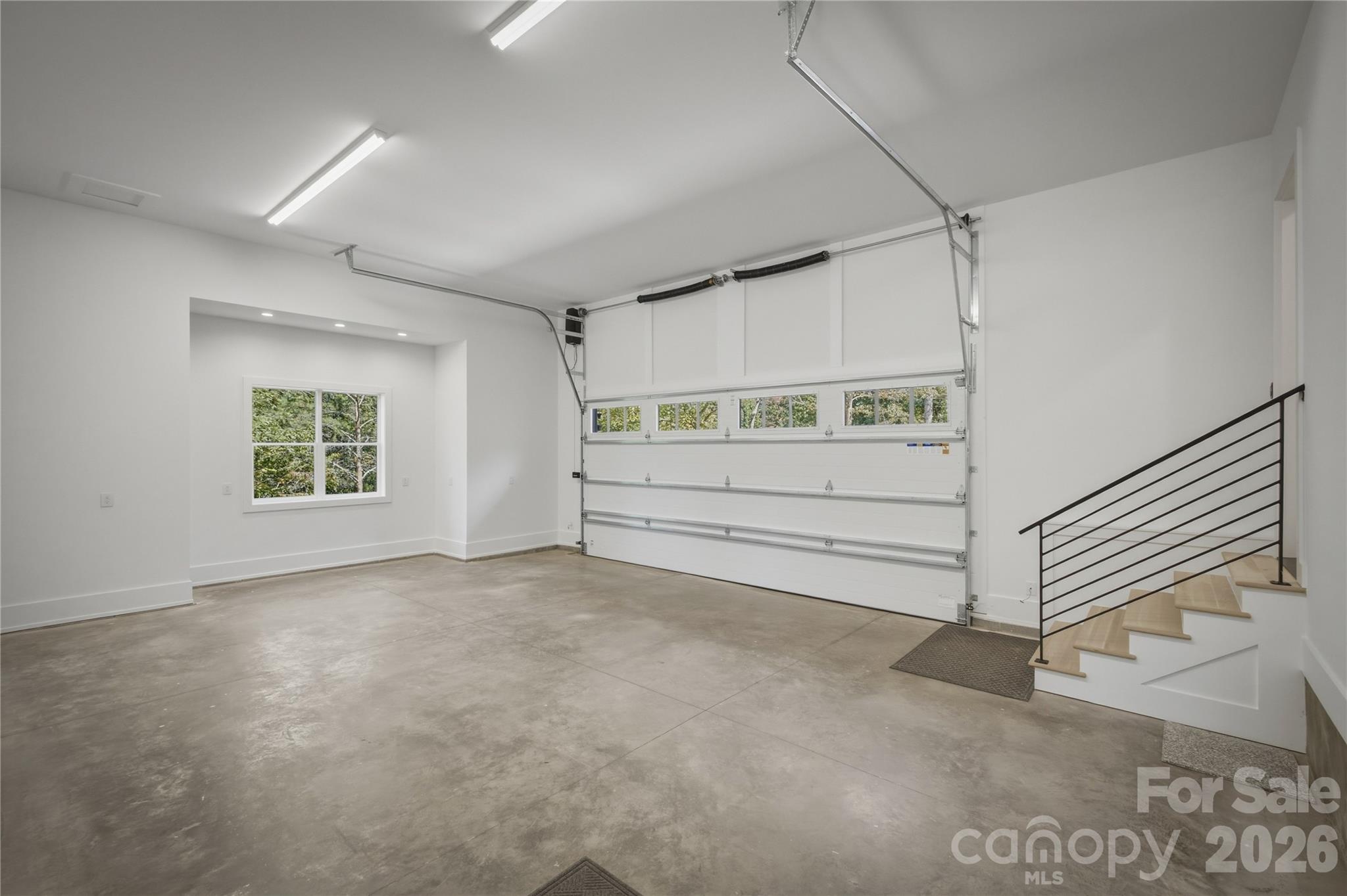Finally, here is the inside of the oversized 2 car garage which has an epoxy flake garage floor. - 2303 Paddock Circle, Morganton