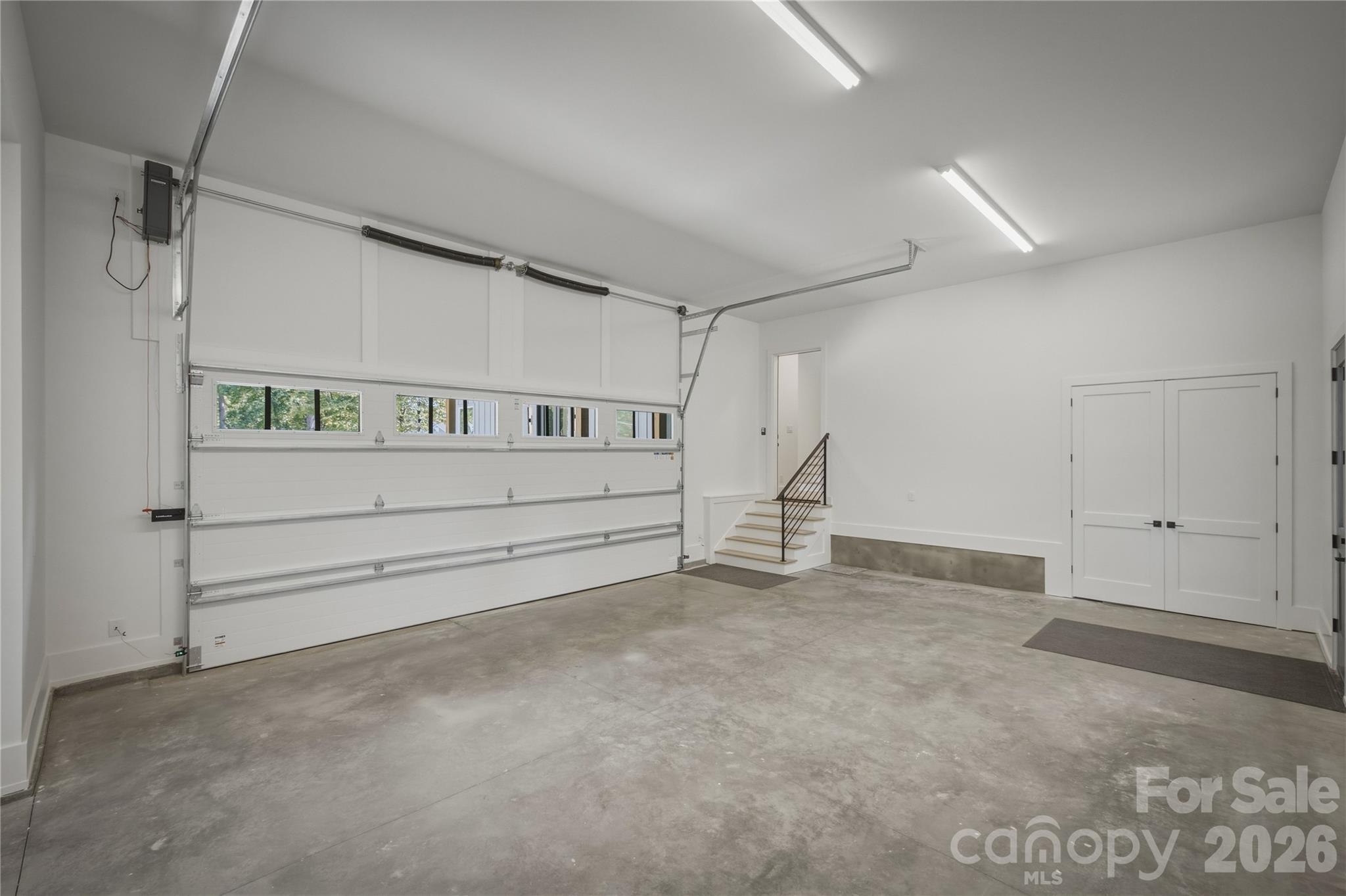 Another view of the garage. See the attached feature and upgrades list for a list of all the high end materials that are incorporated in this spectacular home. Thank you for viewing 2303 Paddock Circle! - 2303 Paddock Circle, Morganton