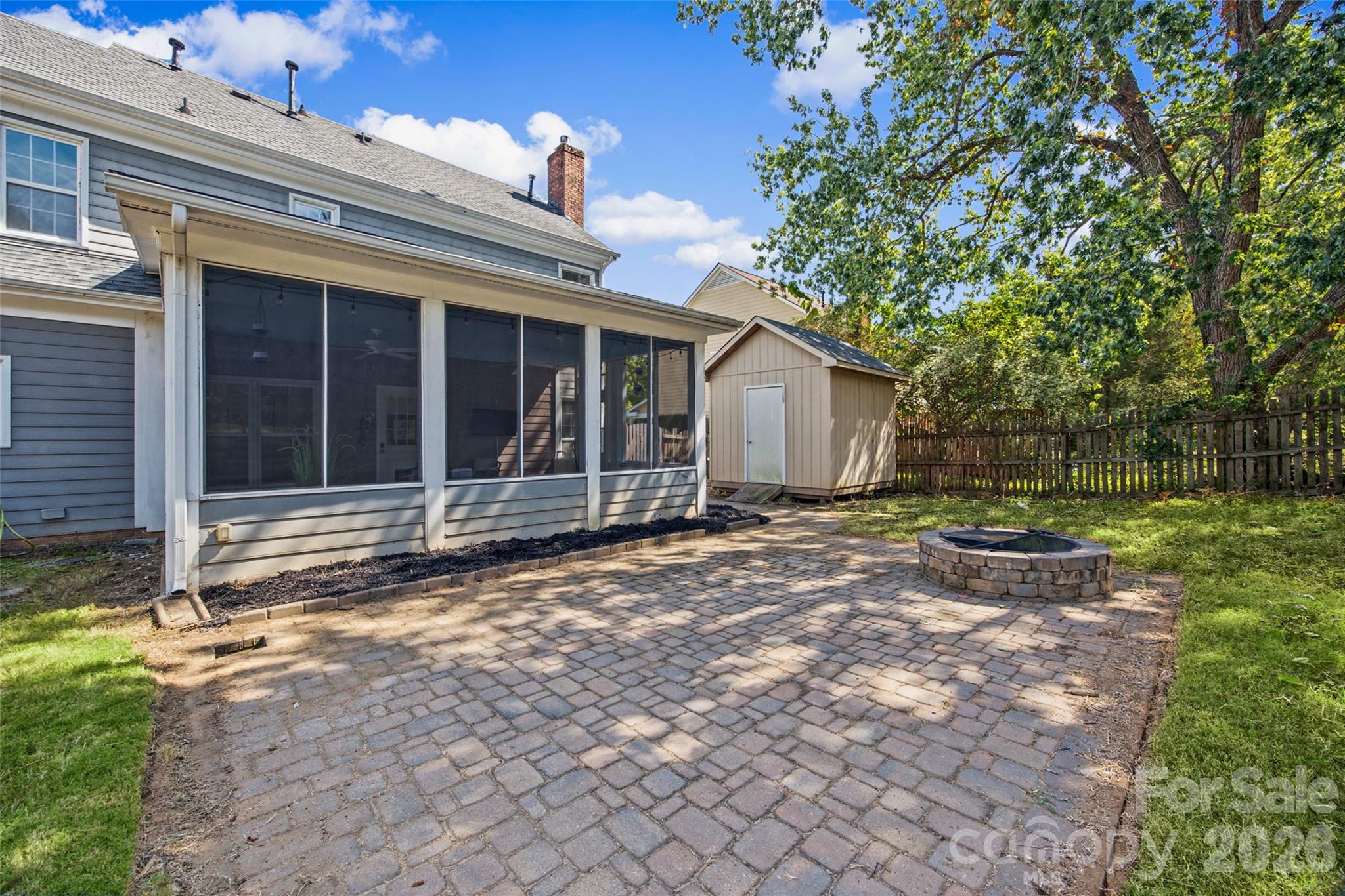 Outdoor paver patio with firepit - 12600 Parks Farm Lane, Charlotte
