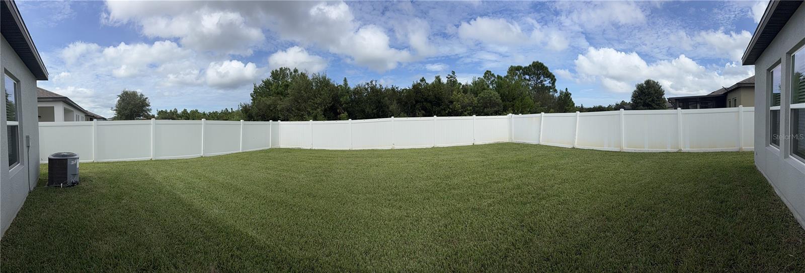 Back fence panoramic - 2858 NEVERLAND DR, NEW SMYRNA BEACH