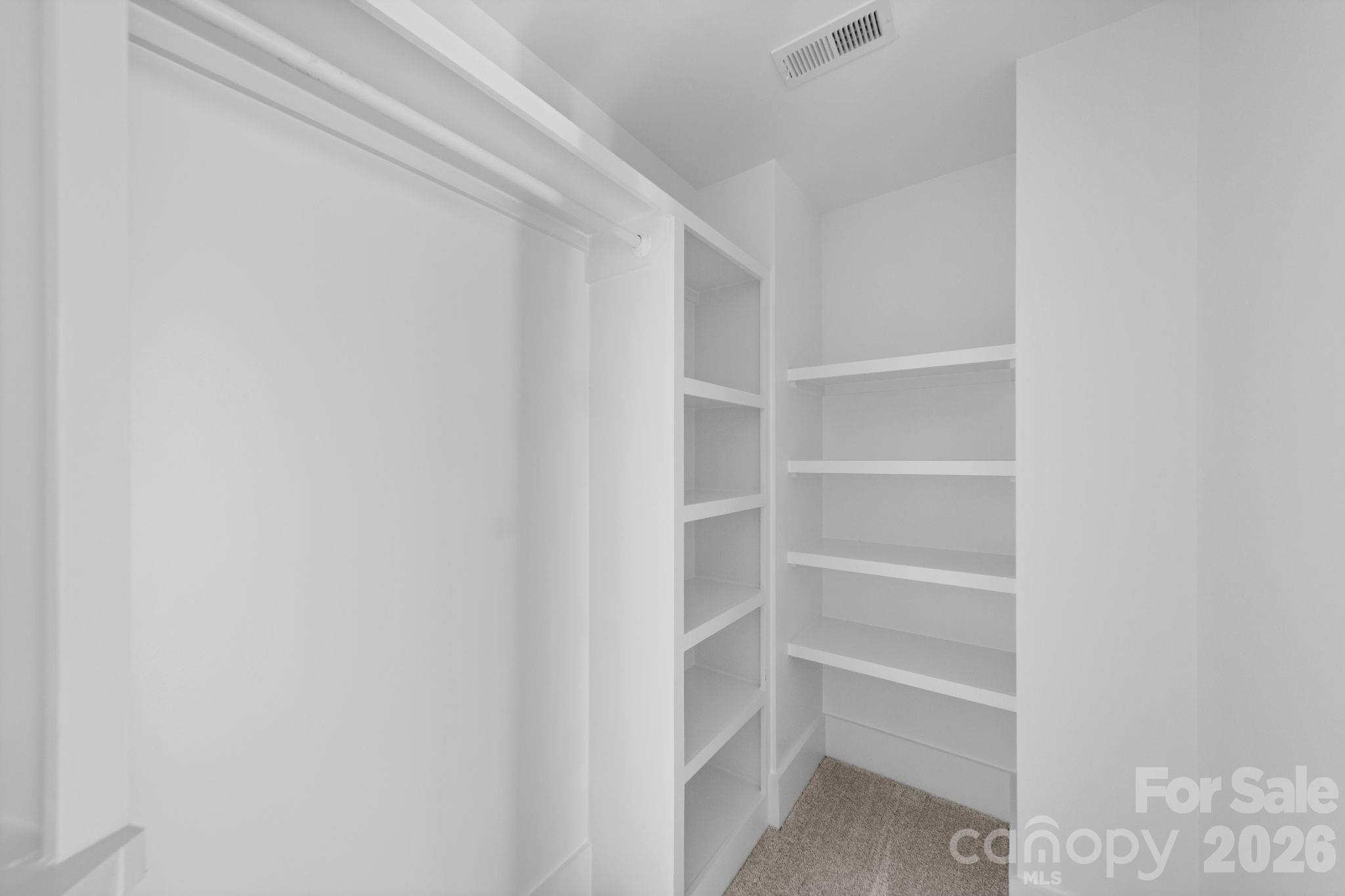 Custom primary closet.Photos are from a previous build and are representative only. Actual finishes, features, and layout may vary slightly. Some photos have been virtually staged. A completed home in Charlotte is available to tour by appointment. - 1222 Wood Street, Albemarle