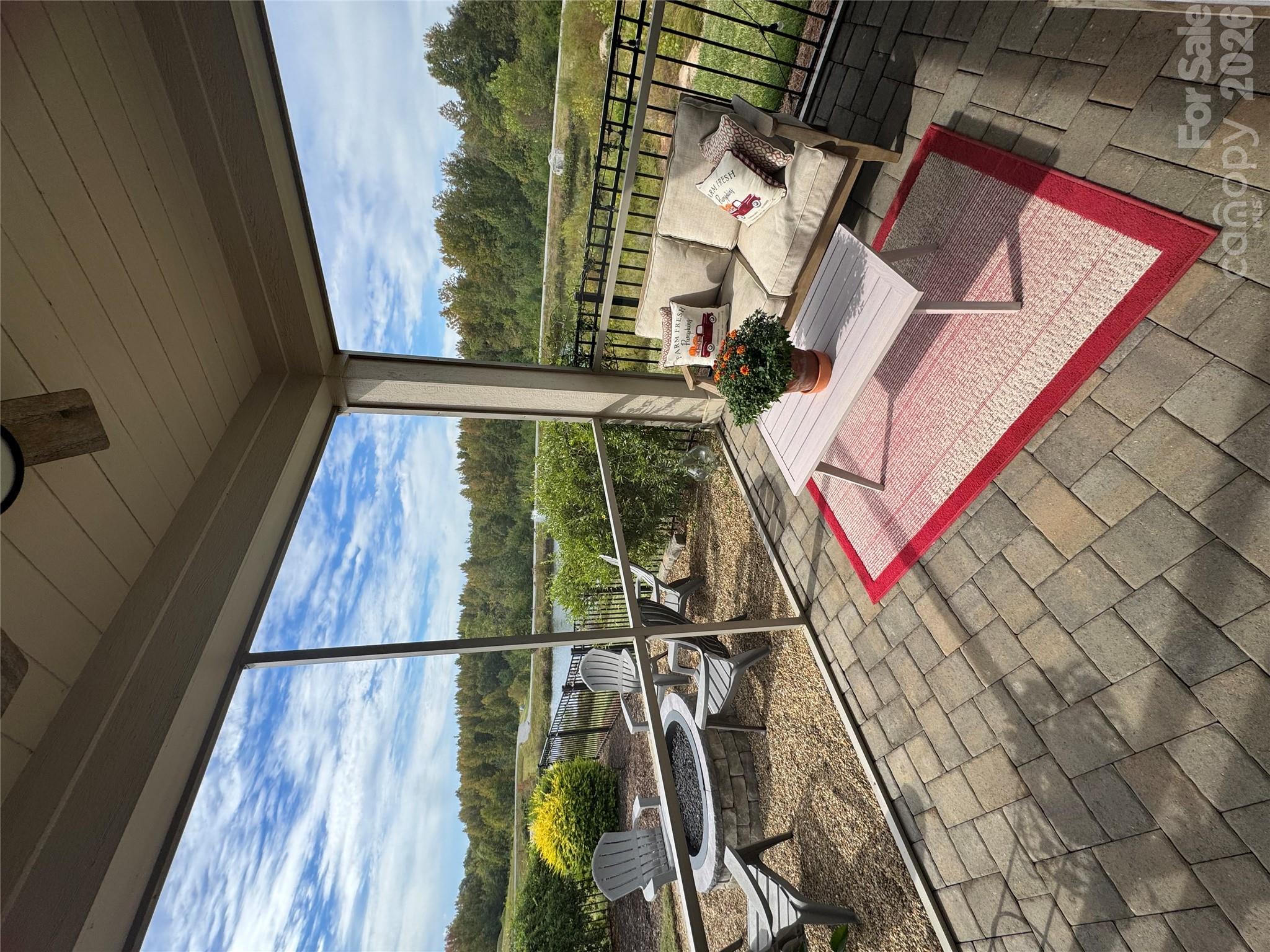 Peaceful cozy screened in porch with entrance from courtyard and primary suite - 9065 Treetop Way NW, Concord
