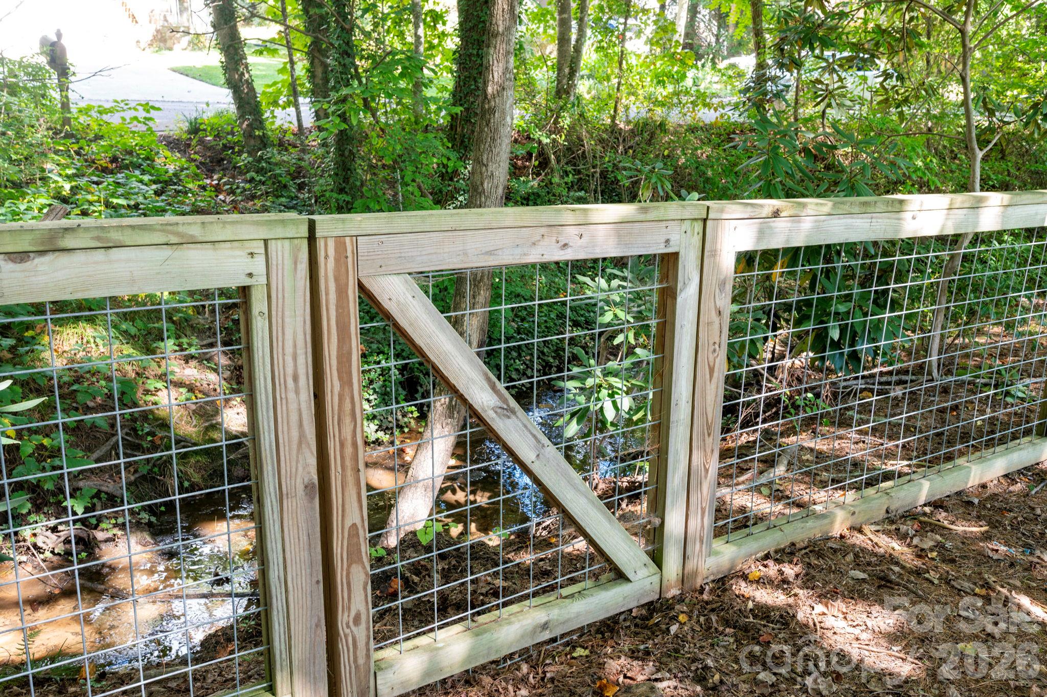 Back Yard Fence and Running Stream - 340 Genesis Circle, Black Mountain