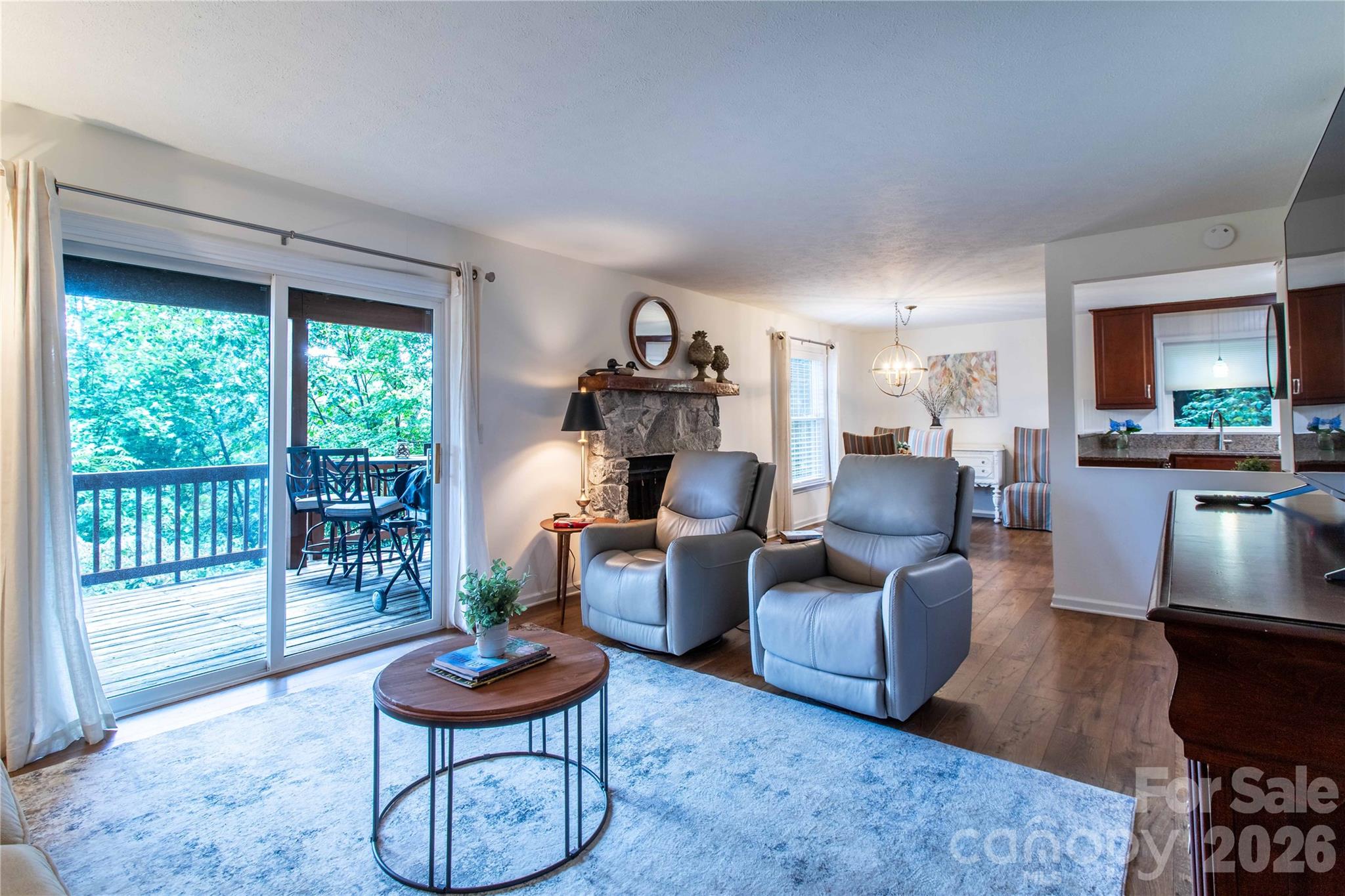 Open layout from living area to kitchen and dining. - 73 Toxaway Views Drive, Lake Toxaway