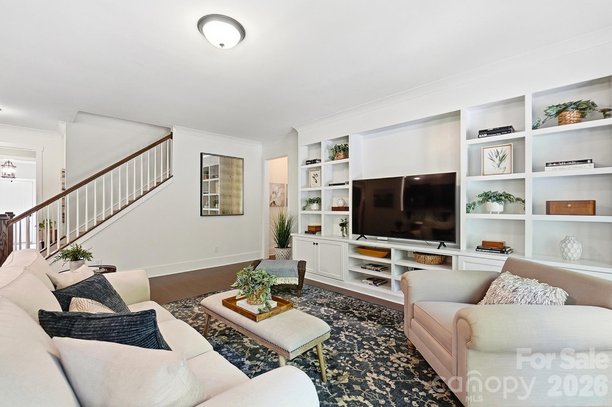 Living room with built in shelves - 1205 Crofton Drive, Waxhaw