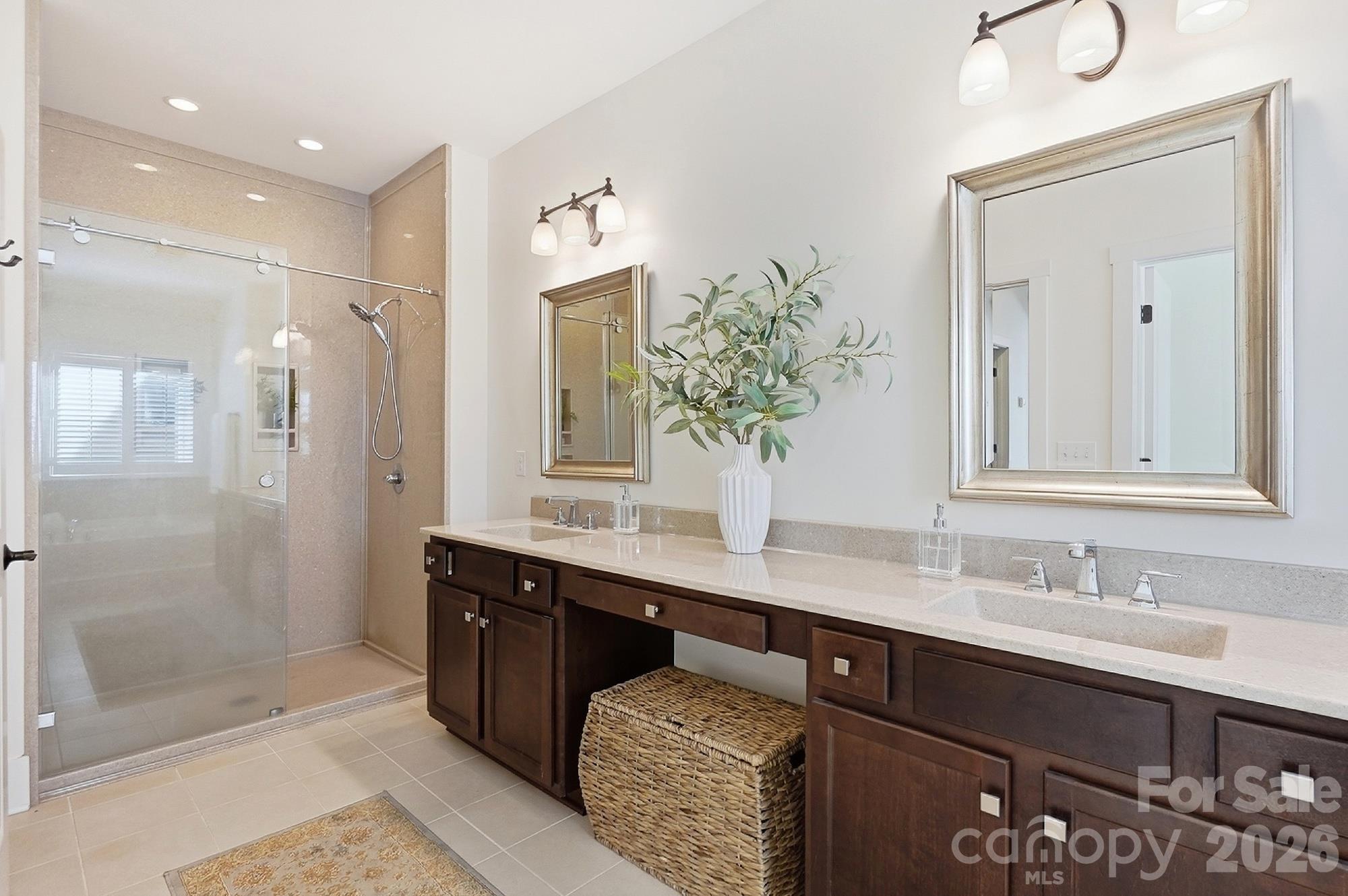 Primary bath with upgraded stone shower. Grout free! - 1205 Crofton Drive, Waxhaw