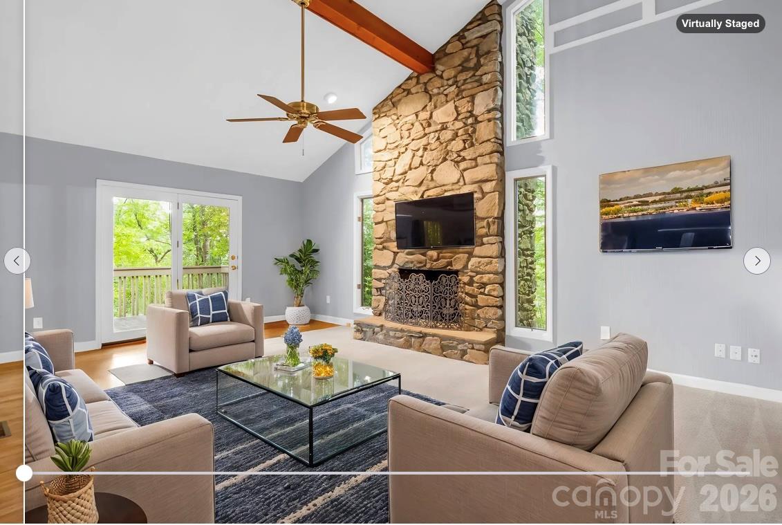 virtually staged: Den with stone fireplace off of Kitchen & Dining Room, door to covered patio & open Deck - 10 Chestnut Ridge Road, Mills River