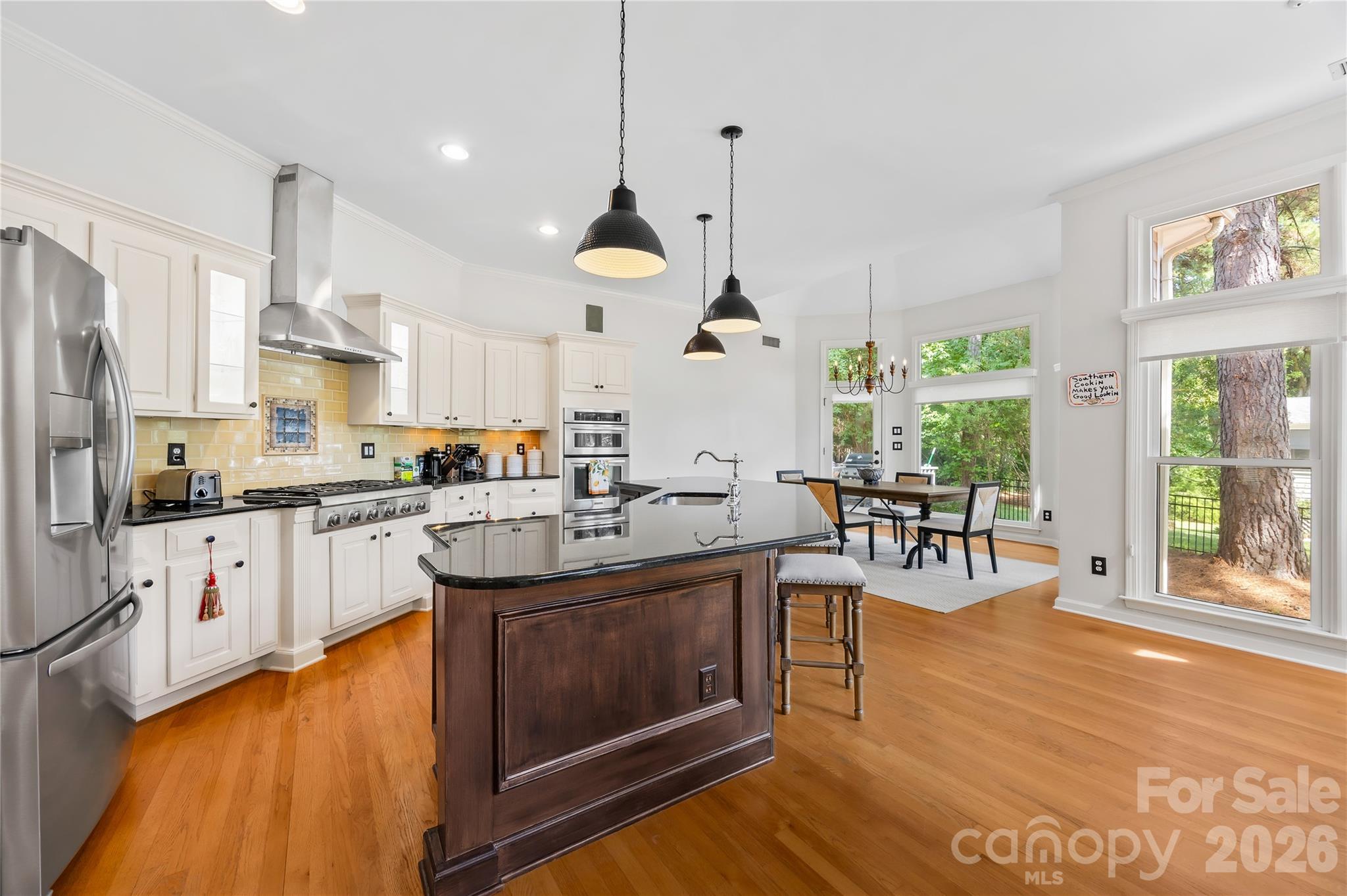 Gourmet Kitchen with hardwoods - large center island - granite countertops and SS appliance's - 15728 Delancey Lane, Huntersville