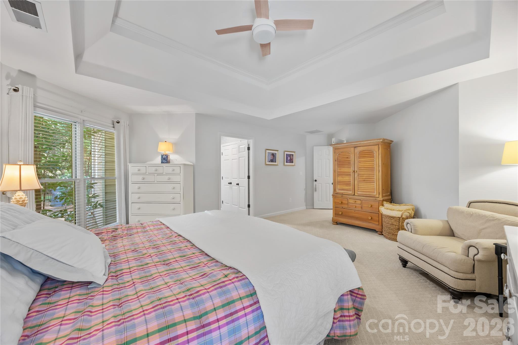 Large Primary bedroom on main level with Trey Ceiling and 2 walk in closets! - 15728 Delancey Lane, Huntersville