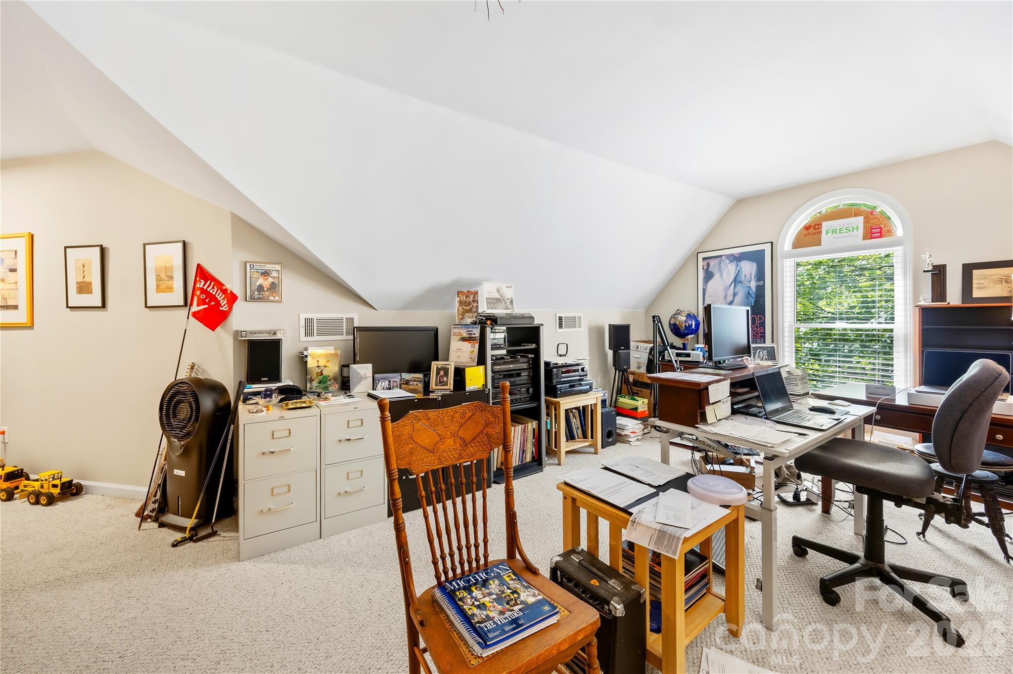 The second story features a massive 447-square-foot finished bonus room over the garage—already rough-plumbed for a future full bath or expansion - 15728 Delancey Lane, Huntersville