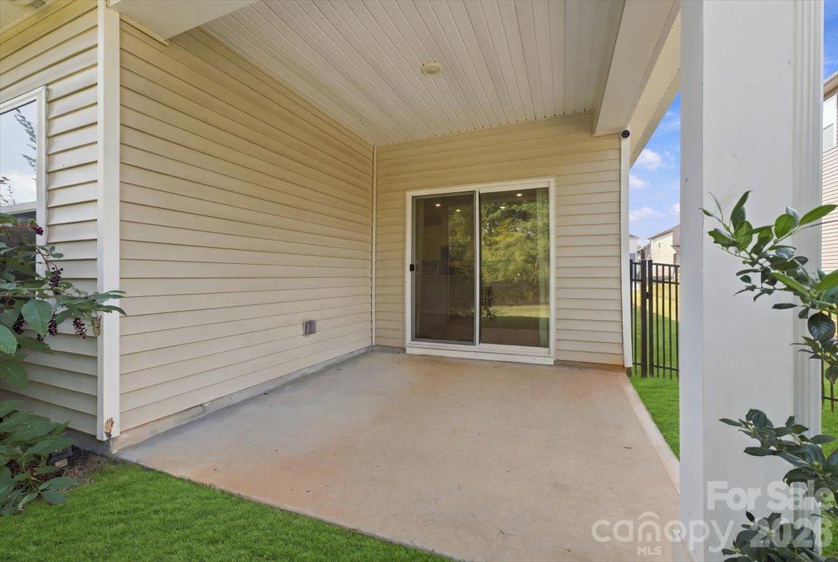 Covered patio off open floor plan- expand living and entertainment areas. Could be screened in too! - 151 Bird Dog Drive, Mooresville