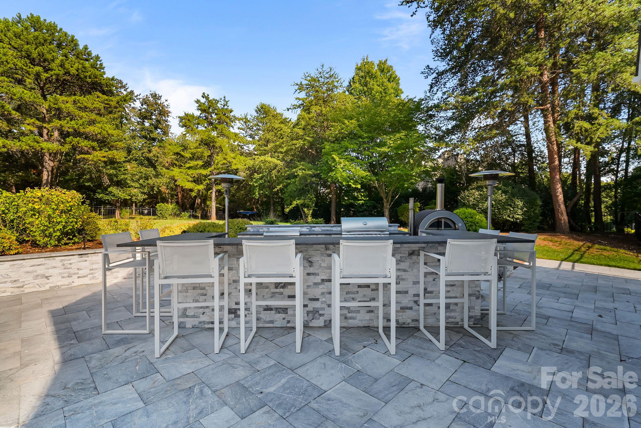 Large high-top bar to add to the enjoyment of this backyard space - 268 Milford Circle, Mooresville