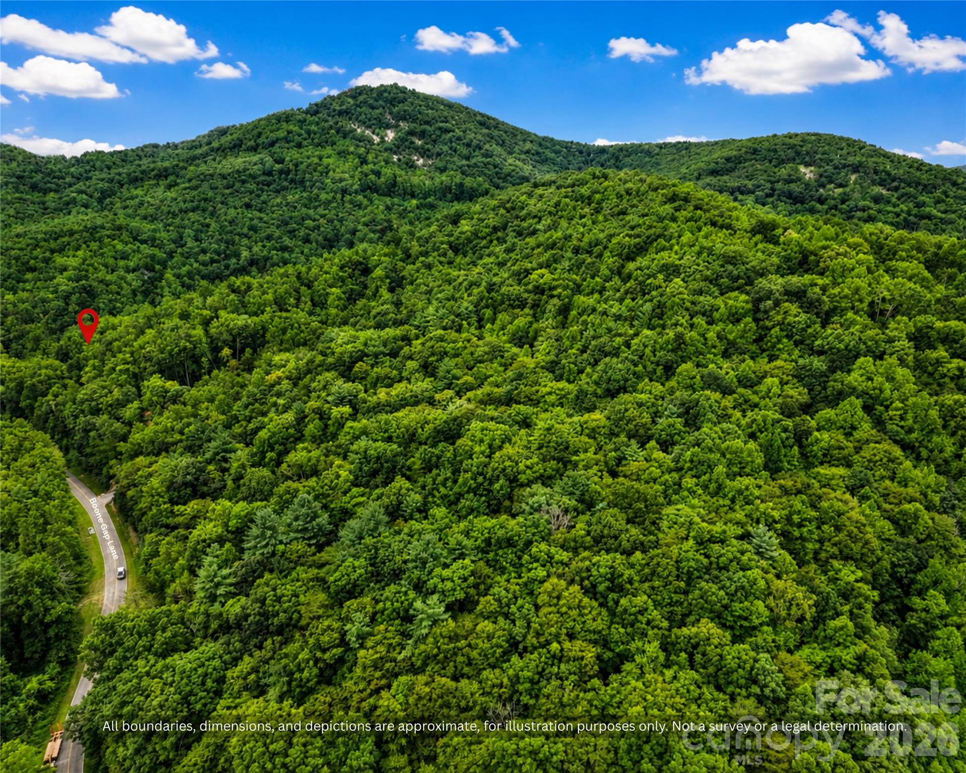 Aerial of about 9 wooded acres in the Brushy Mountain foothills of Alexander County, NC. Owner financing available - 99999 Boone Gap Lane, Taylorsville