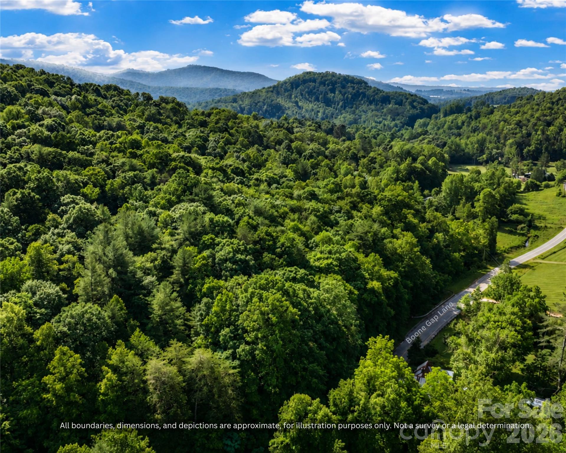 Aerial view of the paved road and wooded acreage, a quiet homesite near Taylorsville - 99999 Boone Gap Lane, Taylorsville