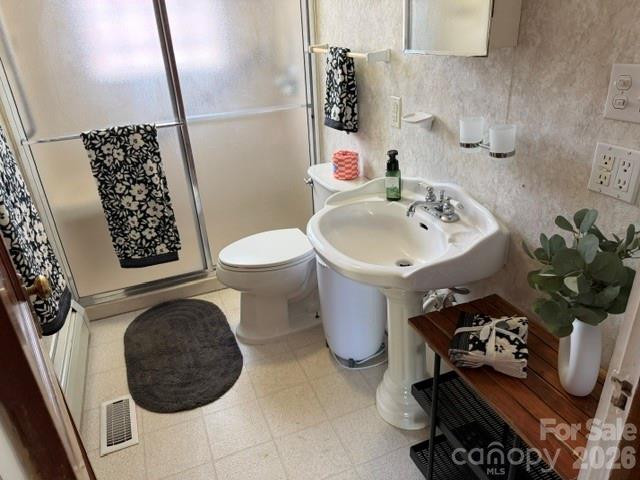 Full bathroom on main floor has accessible walk-in shower and grab bars. Right beside the bedroom. - 615 S Church Street, Salisbury
