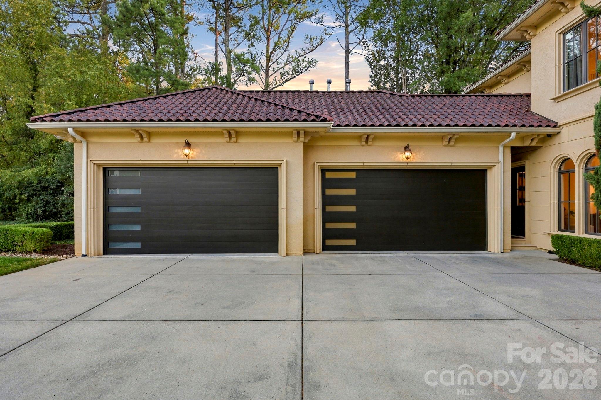 This 4-car garage has a lift in one of the bays, so room for 5 cars! - 21215 Senlac Lane, Cornelius