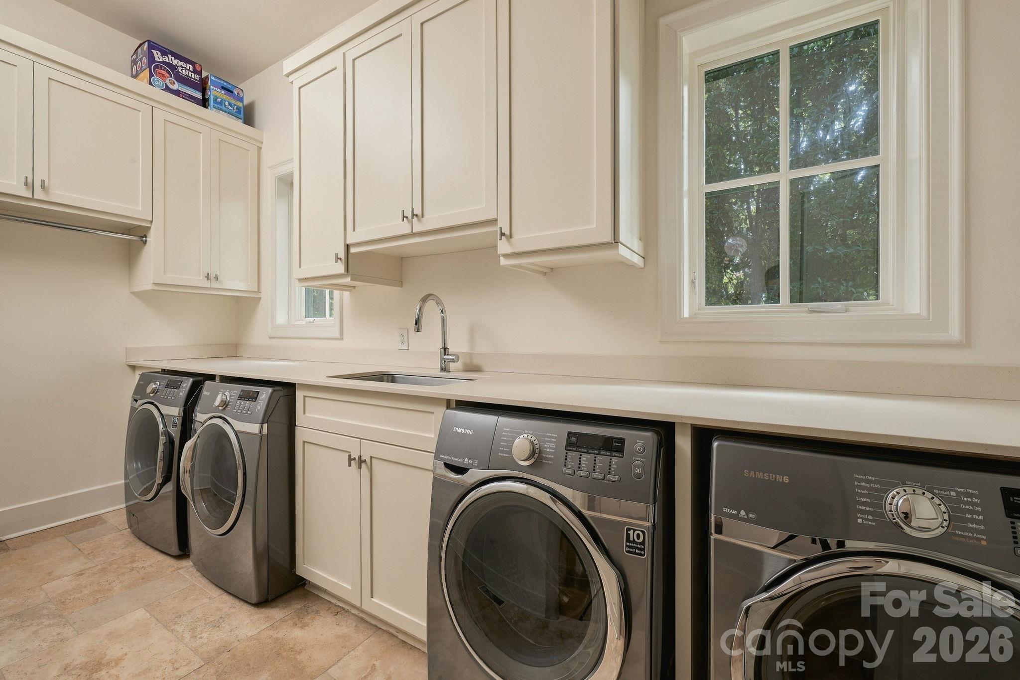 Downstairs large laundry room is a dream with 2 sets of washer/dryer that convey with the home! - 21215 Senlac Lane, Cornelius