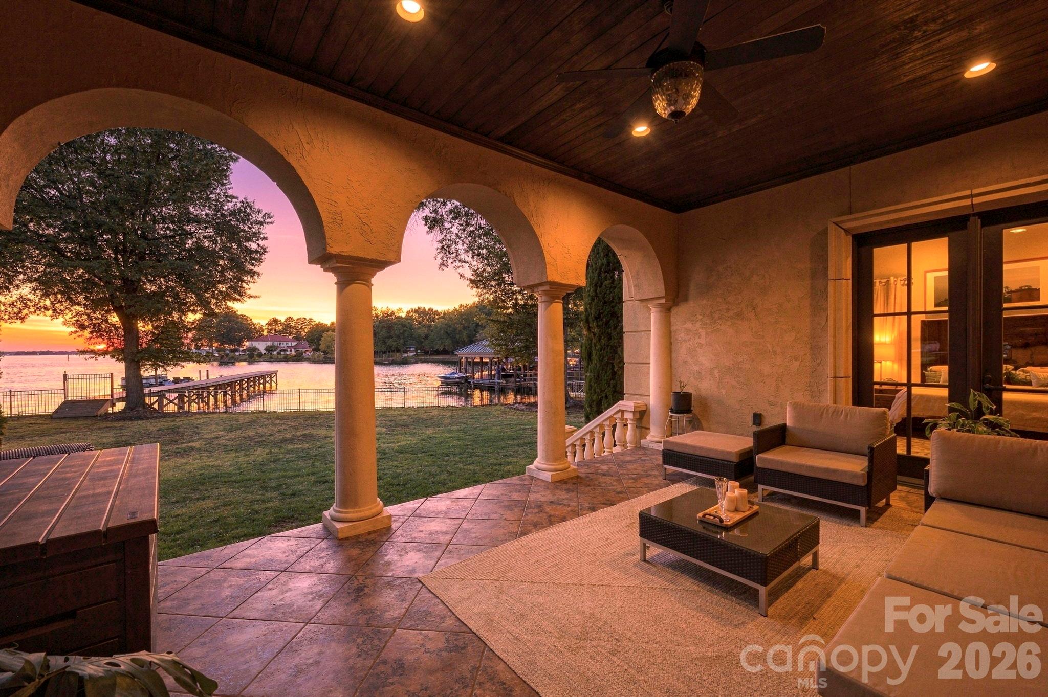 The back patio where you will watch endless sunsets on Lake Norman! - 21215 Senlac Lane, Cornelius
