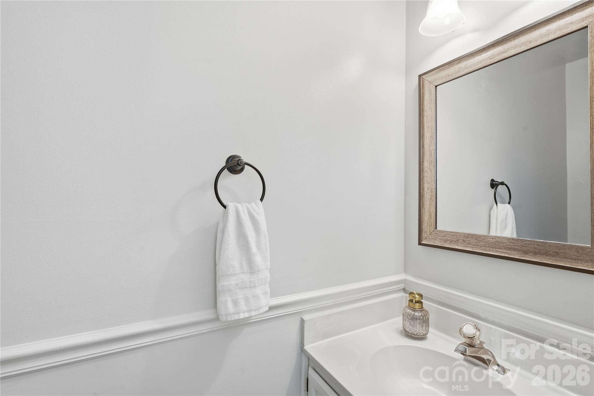 Convenient powder room on main level for guests - 717 Fredricksburg Road, Matthews