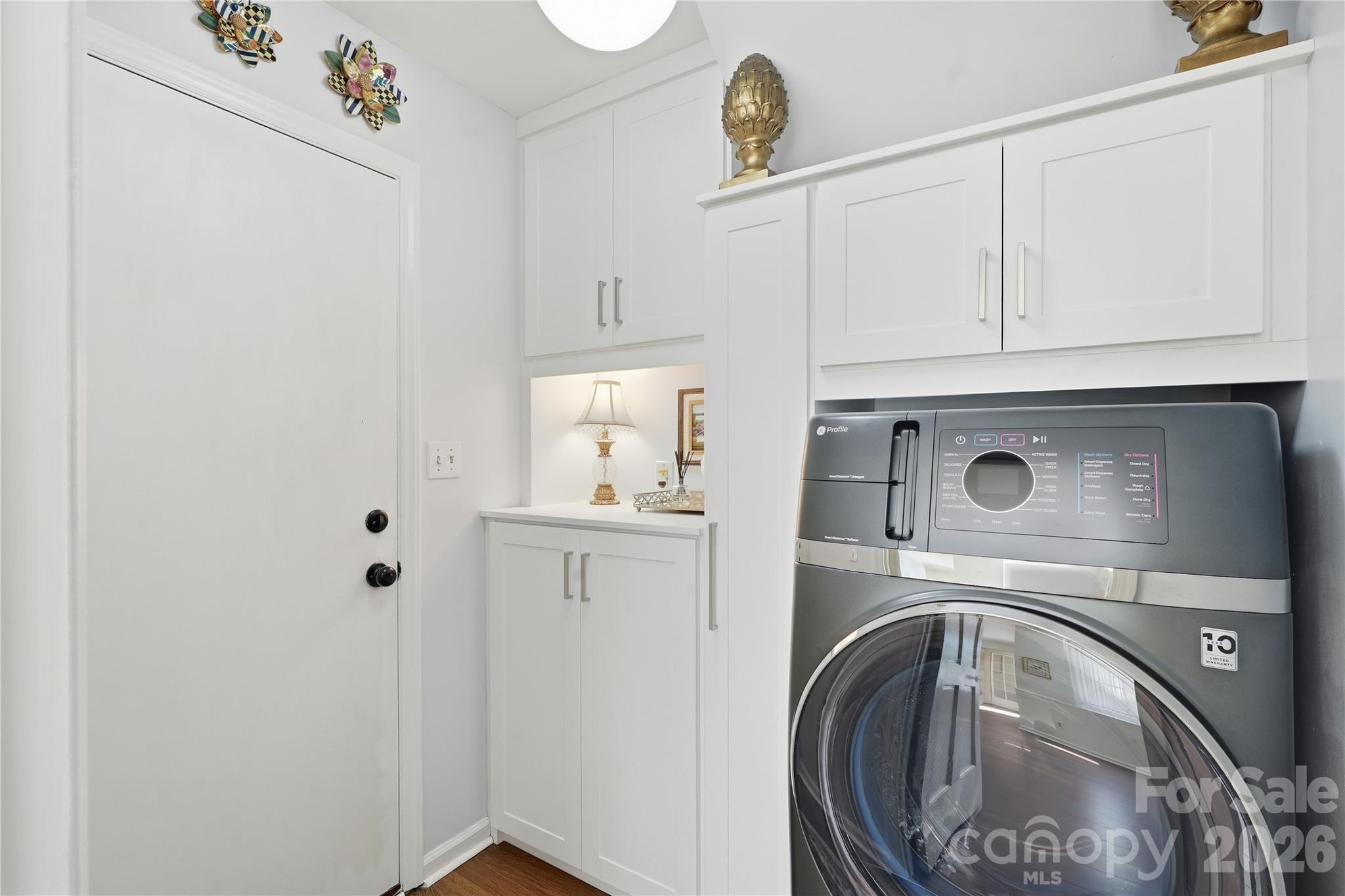 Laundry room with storage organization system - 717 Fredricksburg Road, Matthews