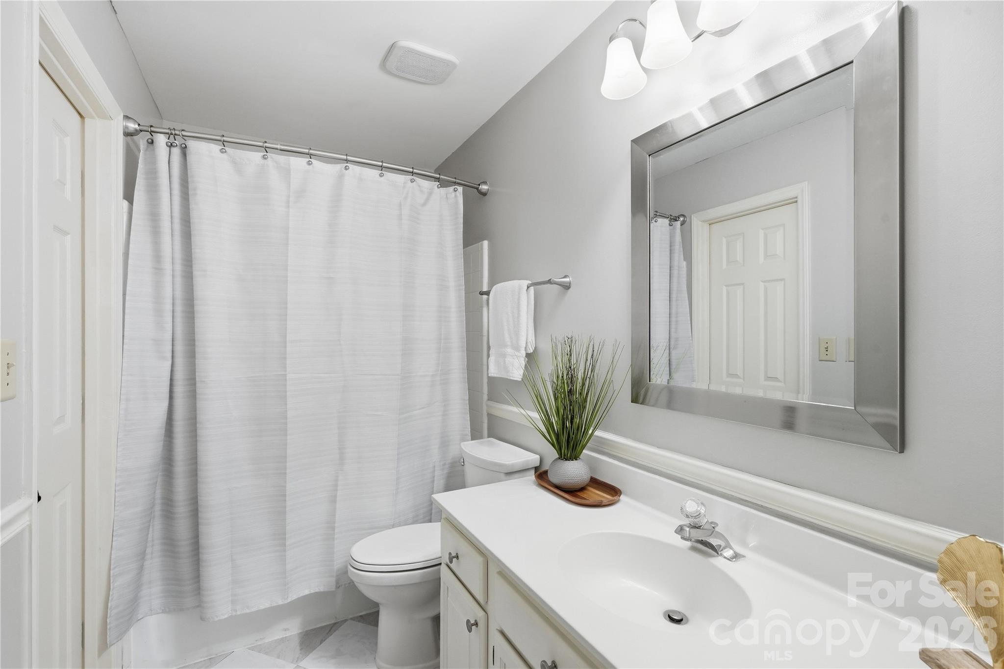 Shared bathroom with new flooring and freshly painted walls - 717 Fredricksburg Road, Matthews