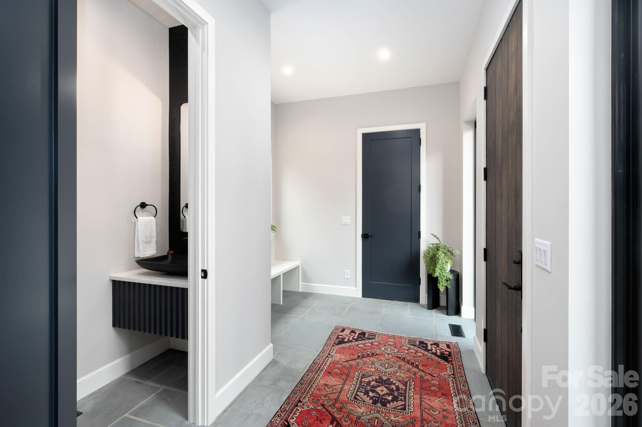 Beautifully Unique Dogtrot Entry with Blue Stone Flooring and Powder Room - 25 Ted Linn Drive, Fairview