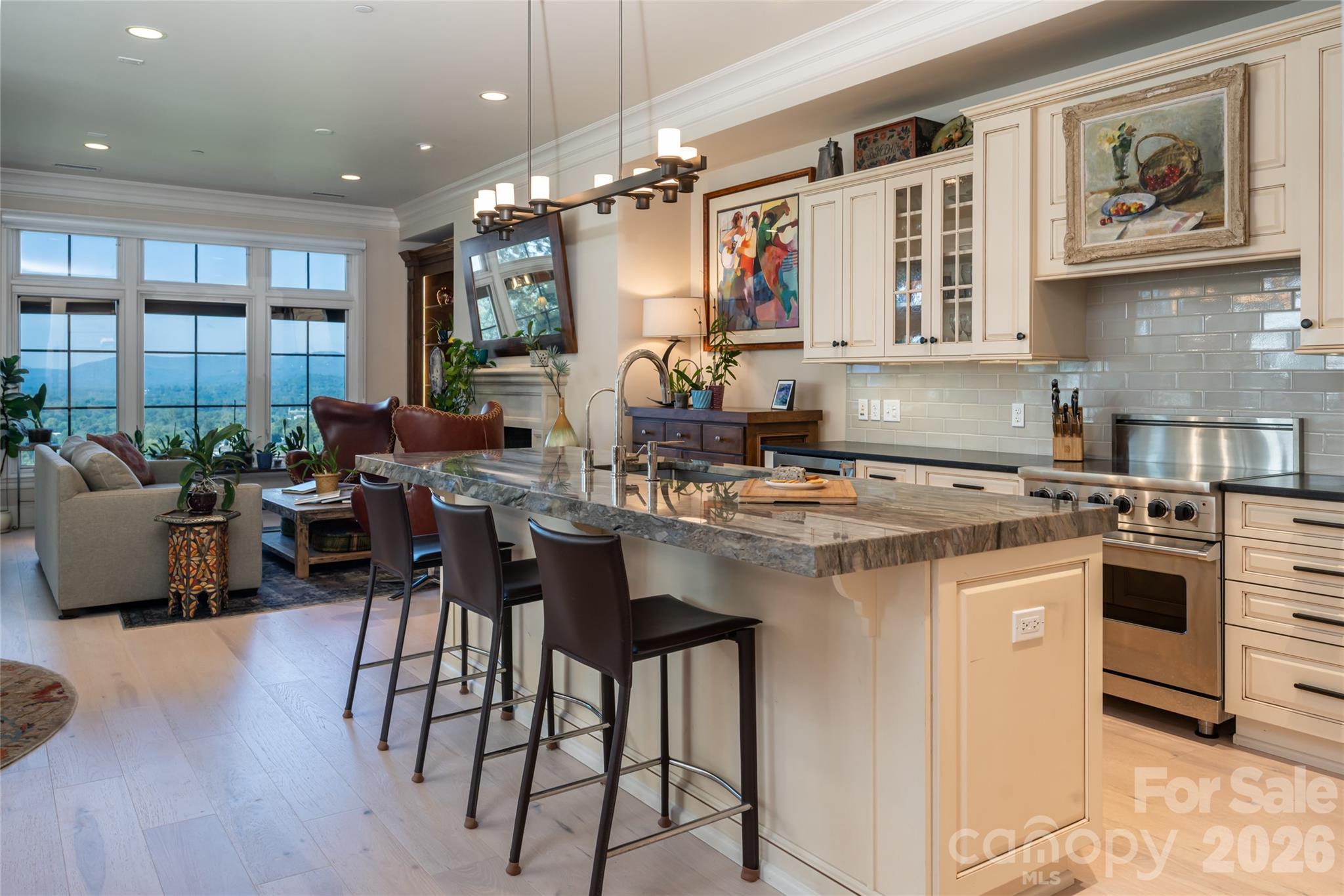Large center island with double thickness granite countertop and ample seating - 288 Macon Avenue, Asheville