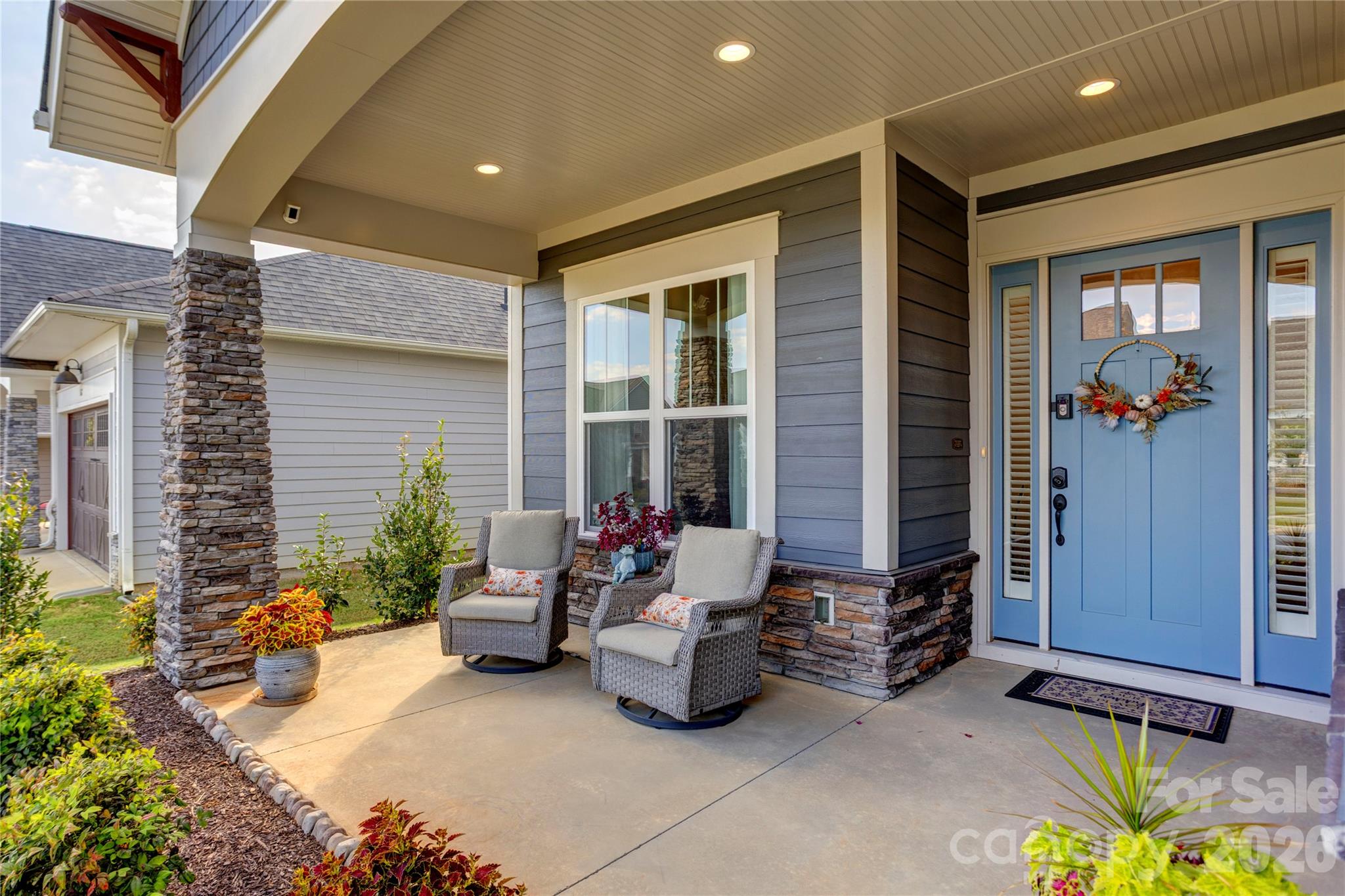 A covered front porch made for morning coffee and waving to neighbors. - 158 Fulworth Drive NW, Concord