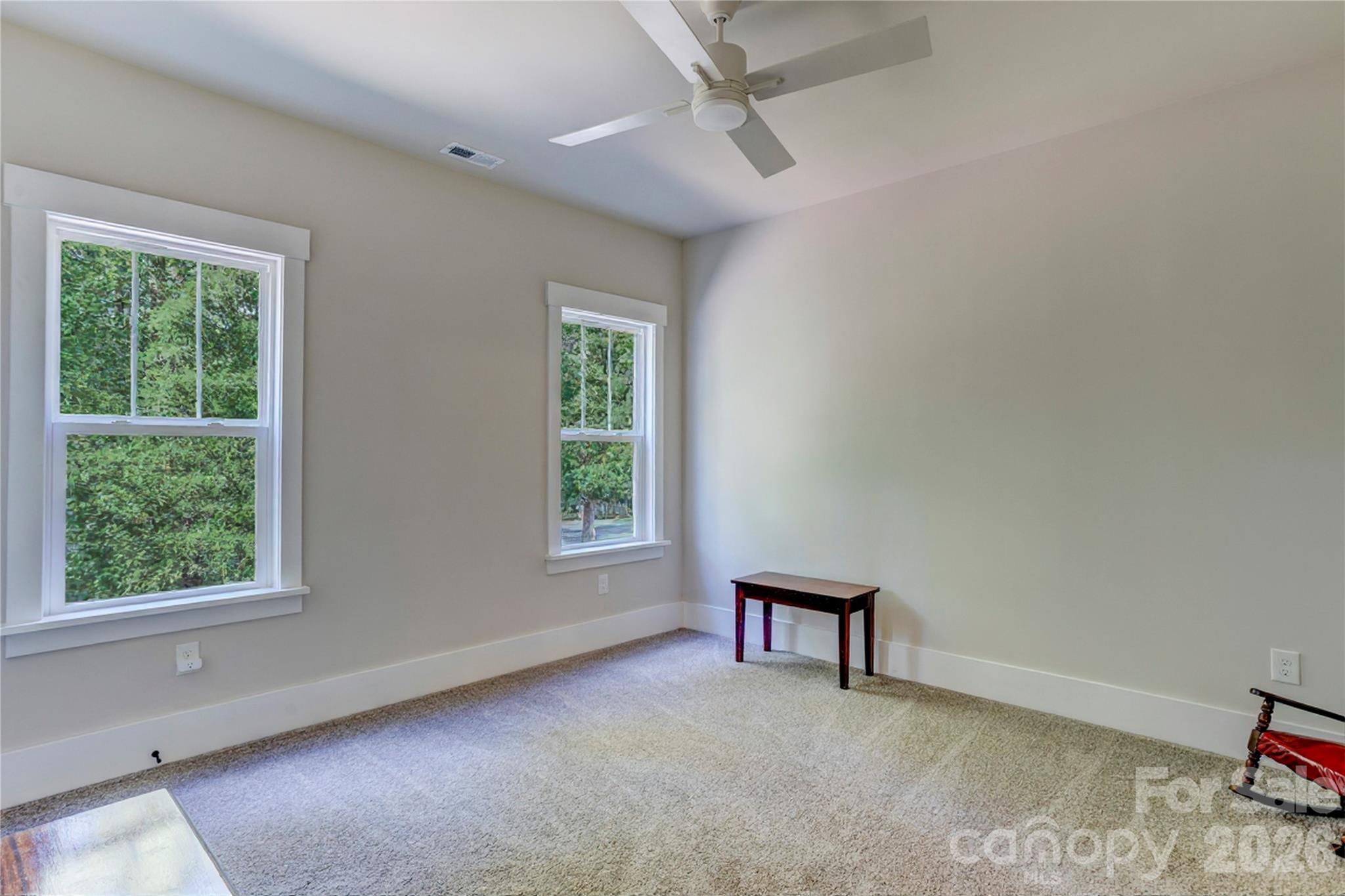 An upstairs bedroom gives guests their own private space. - 158 Fulworth Drive NW, Concord