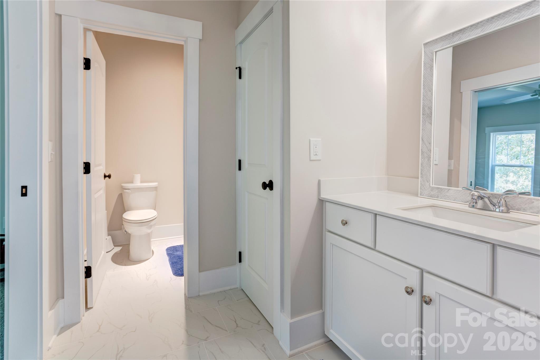 A full bath upstairs keeps the second level self-contained for guests. - 158 Fulworth Drive NW, Concord