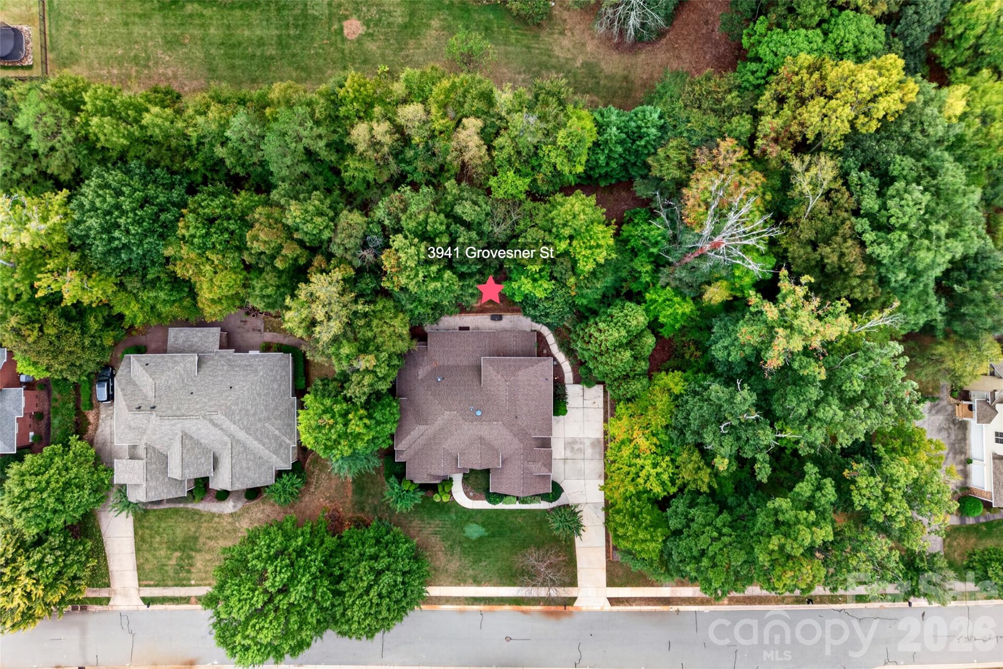 Home is surrounded by trees with a private, wooded, fenced-in backyard. - 3941 Grovesner Street, Harrisburg