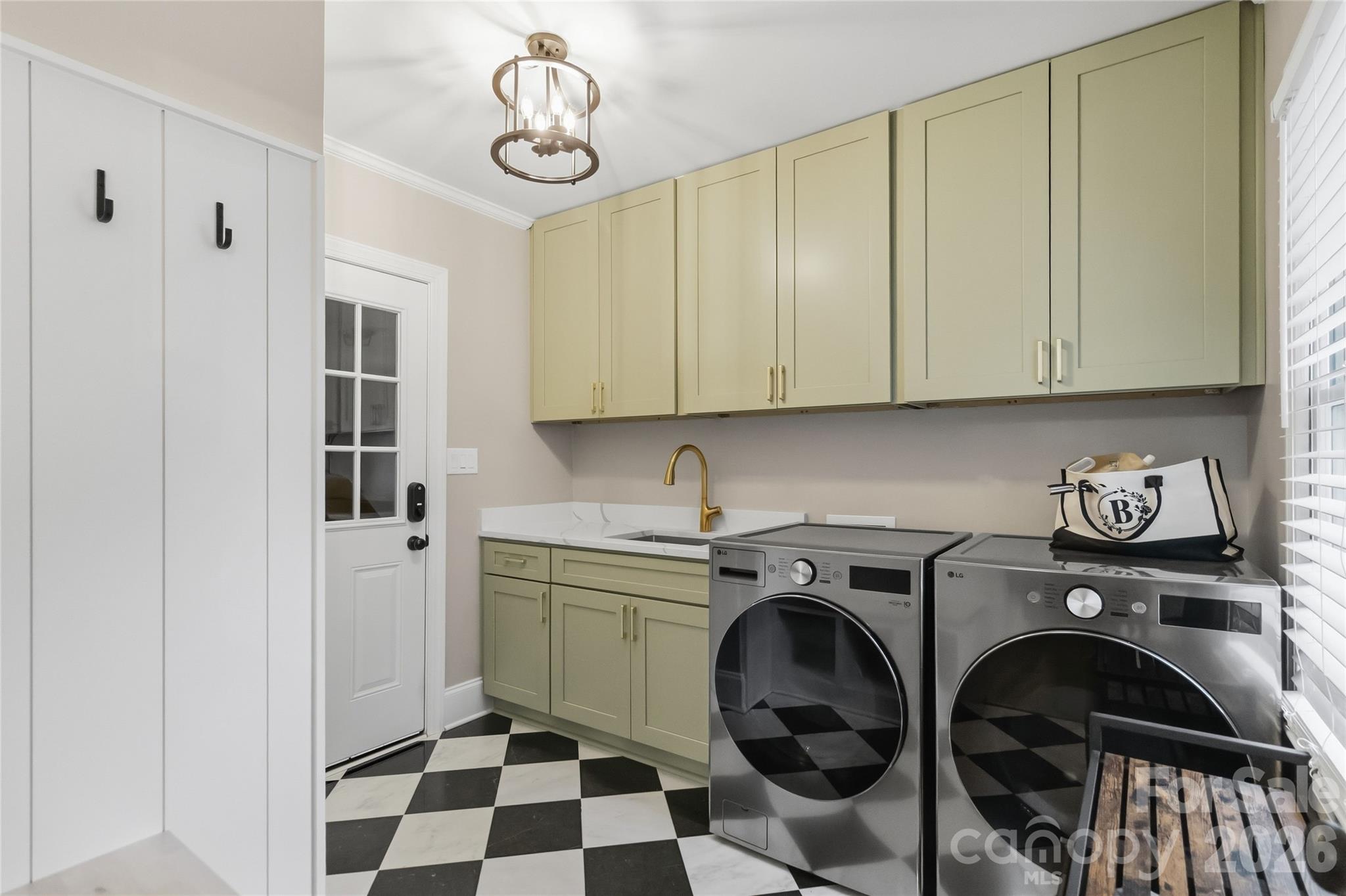 Mud/ Laundry room from garage entry, newly renovated - 9414 Tillot Drive, Matthews