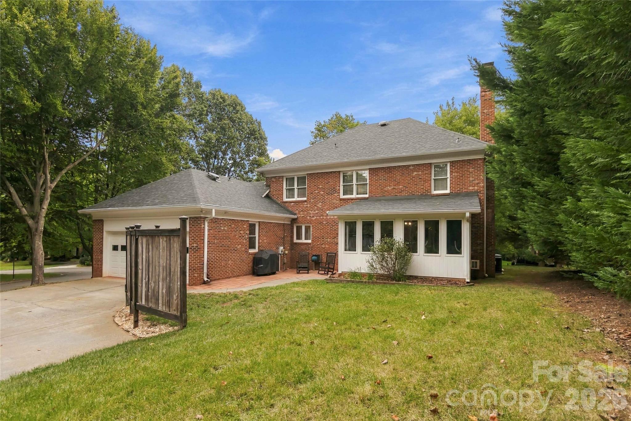 Rear of home looking back at the sunroom - 9414 Tillot Drive, Matthews