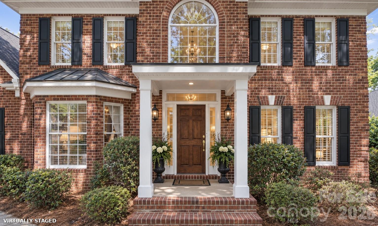 Brand new painted trim and windows and new exterior lighting. Virtually staged. - 2401 Flagstick Drive, Matthews