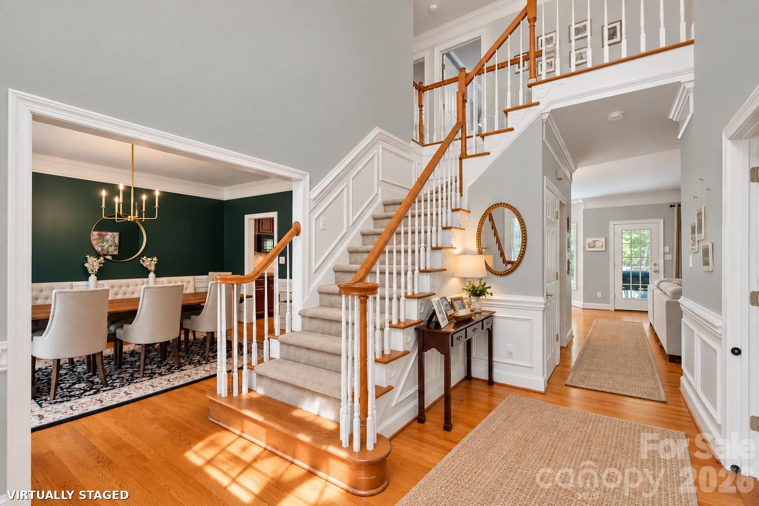 Brand new Benjamin Moore Calm throughout most of downstairs. Rugs in hall virtually staged. - 2401 Flagstick Drive, Matthews