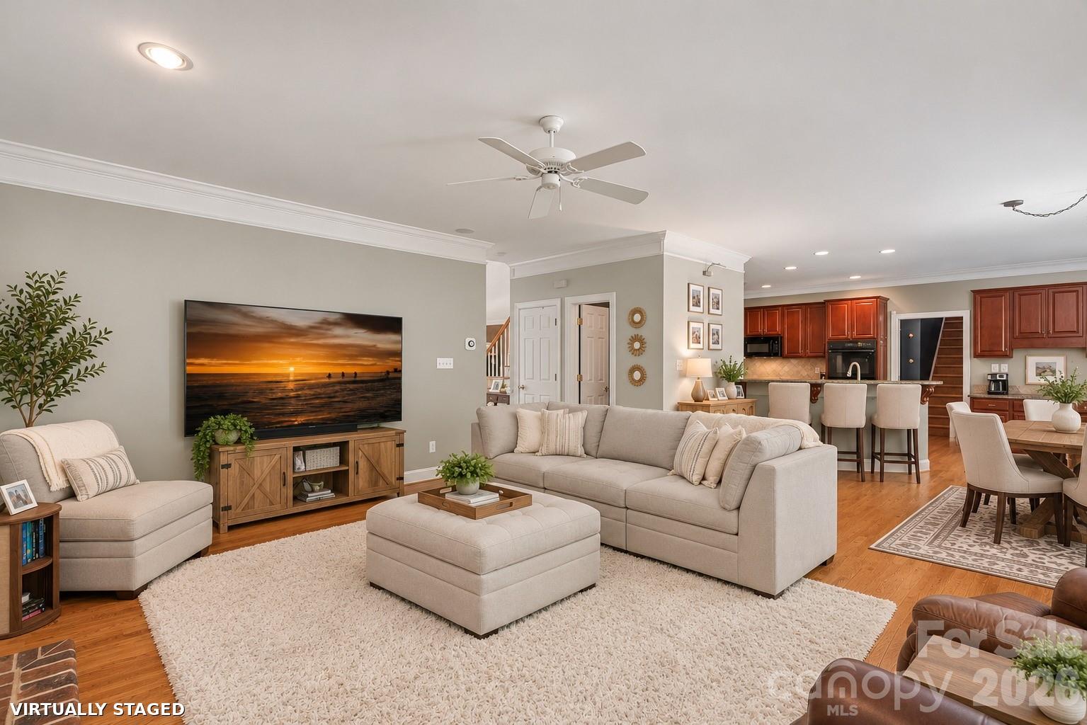 Brand new Benjamin Moore Calm throughout most of downstairs. Greenery, barstools and kitchen rug virtually staged. - 2401 Flagstick Drive, Matthews